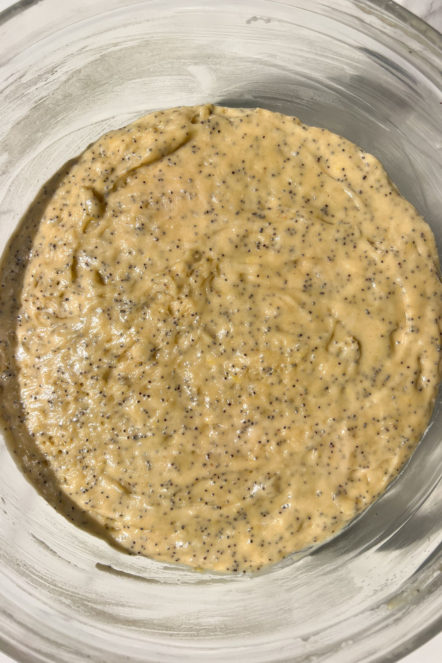 Lemon poppy batter resting in the bowl.