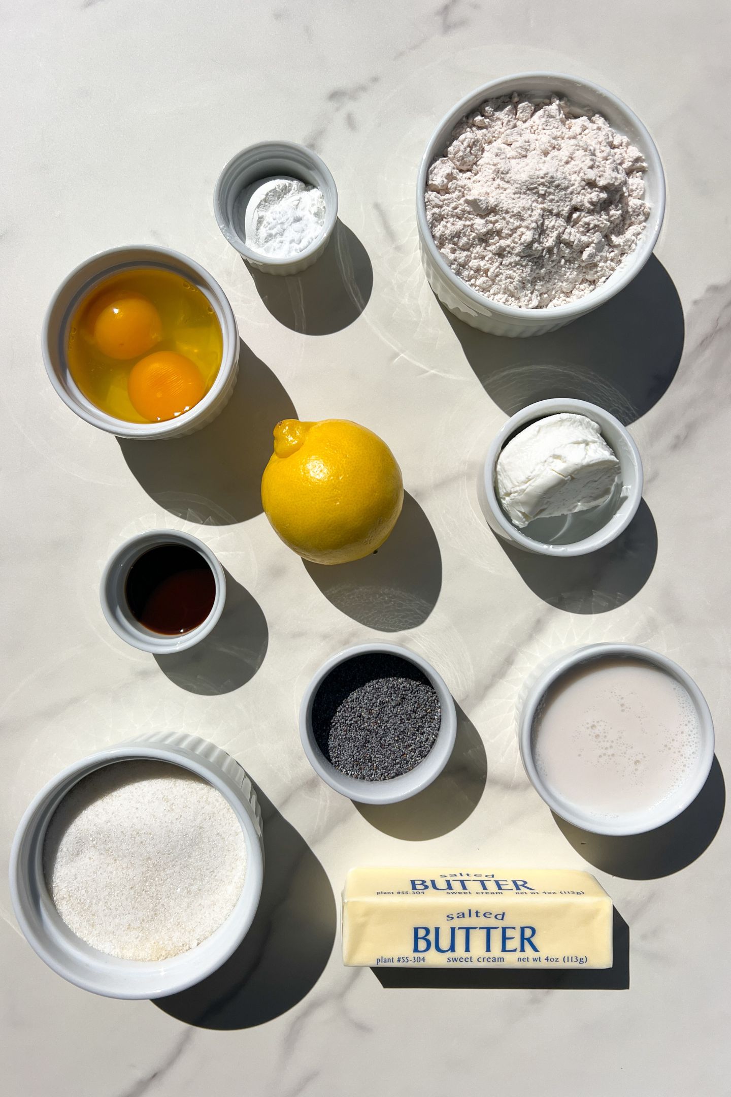 Ingredients measured out in bowls to make gluten free lemon poppy seed muffins.