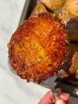 Holding a Crispy Parmesan Potato on a fork.