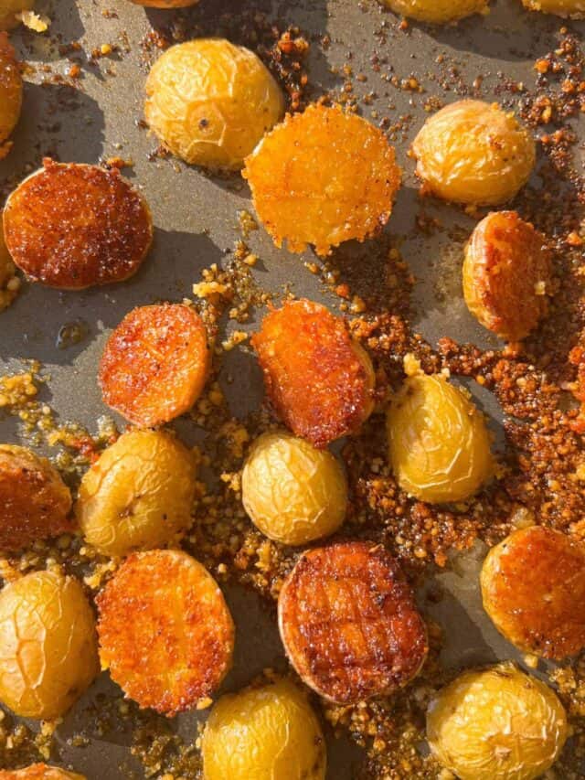 Crispy parmesan crusted potato halves on a pan