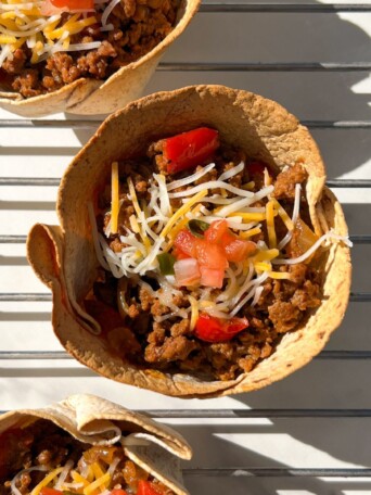 Beef Taco Cups on a cooling rack ready to be eaten.