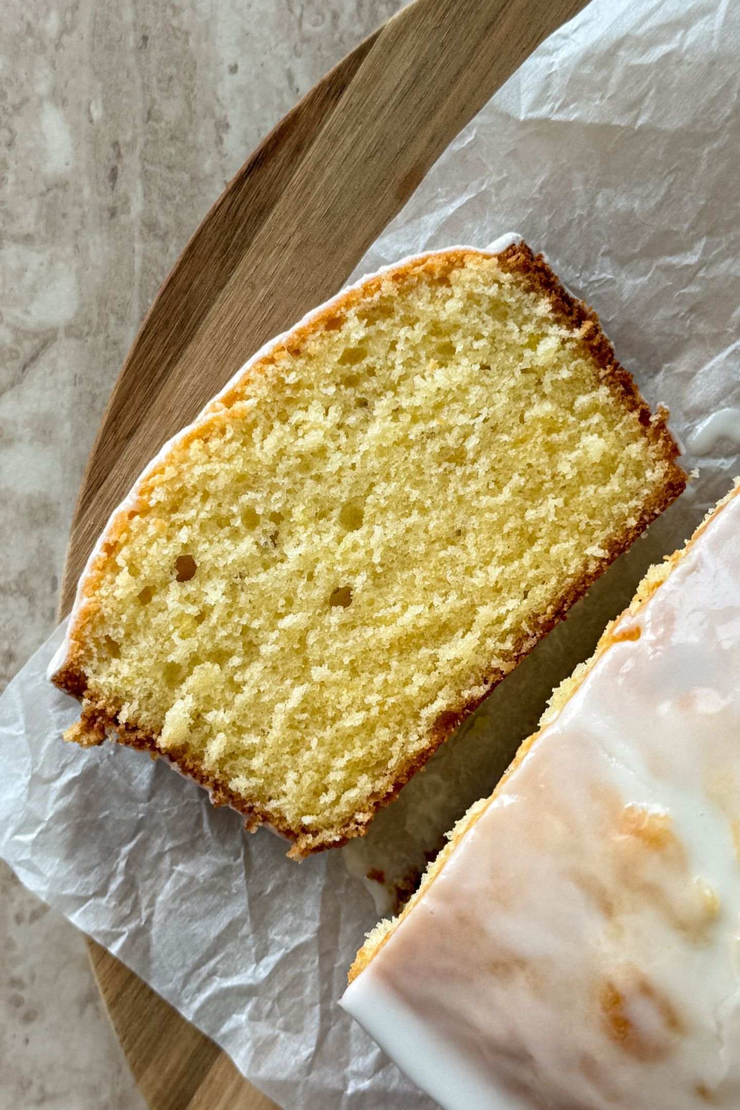 A slice of lemon pound cake on the platter.