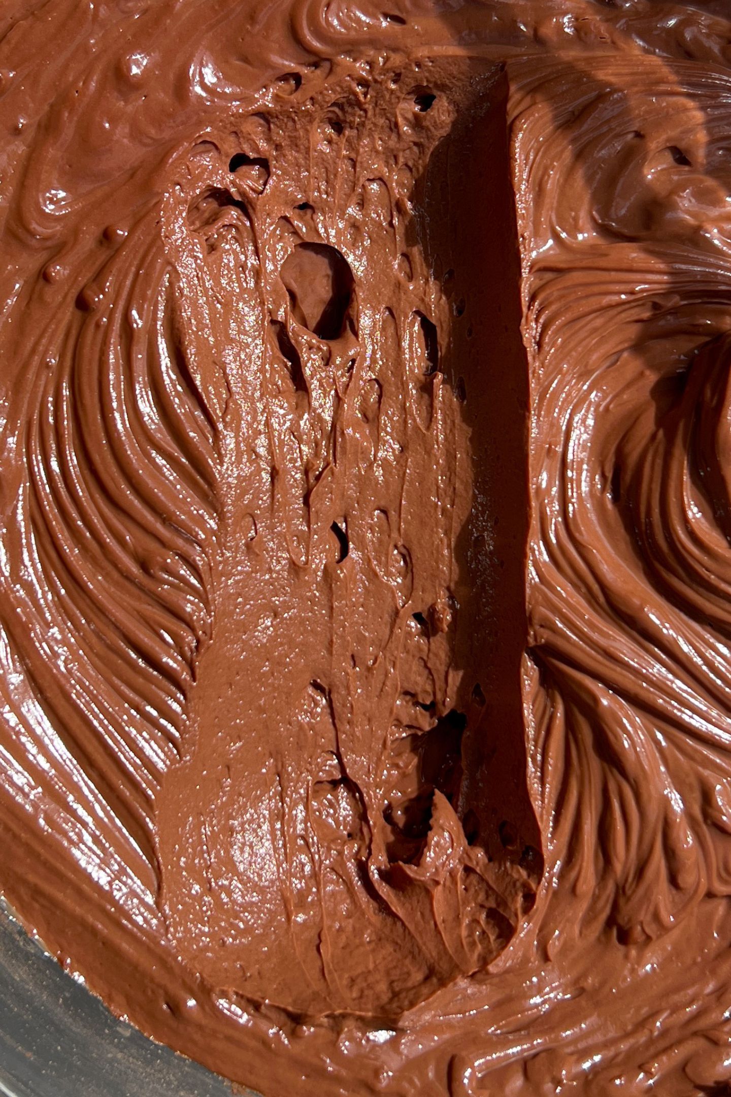 Scooping mousse in the bowl after being chilled.