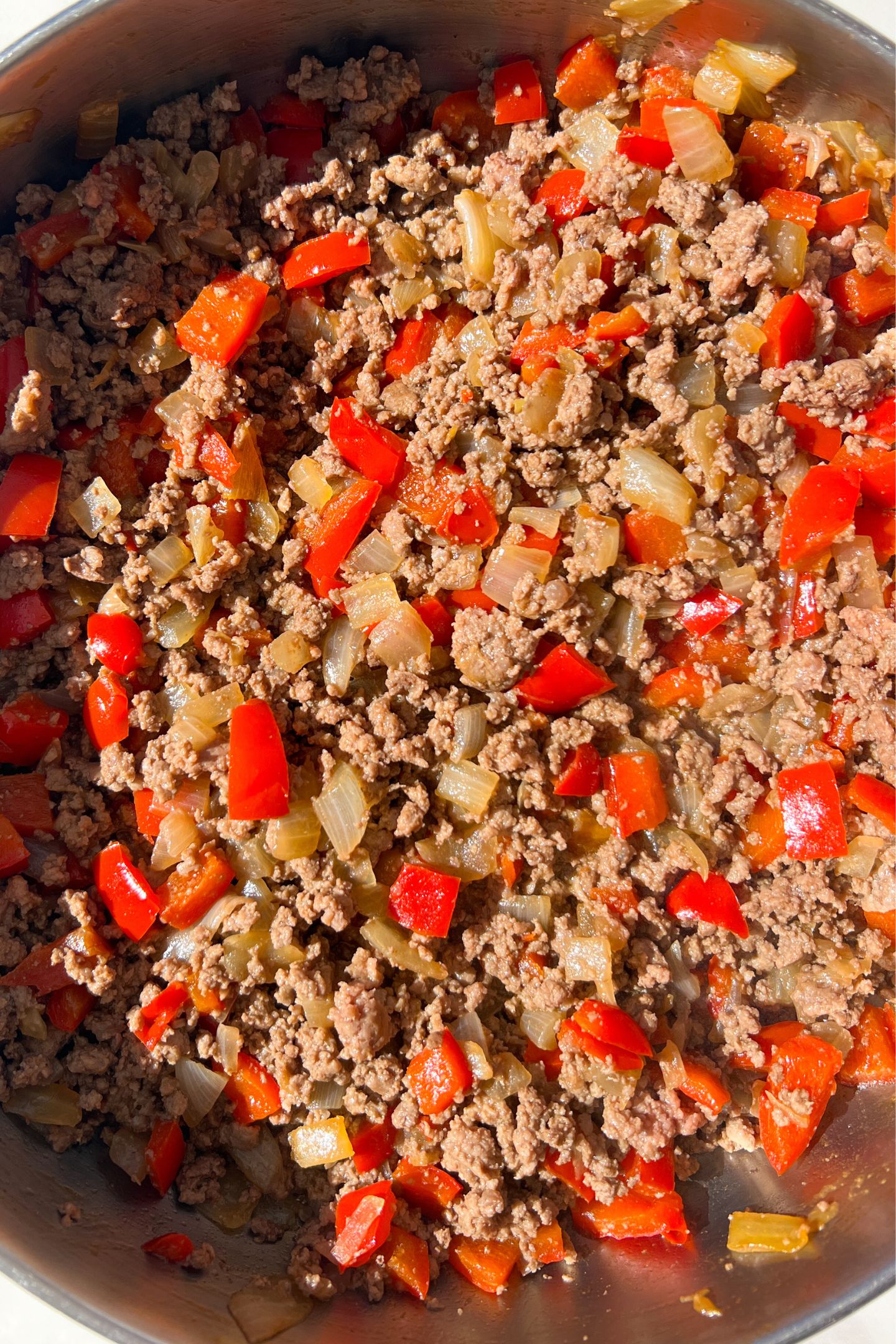 Ground beef mixed with peppers and onions