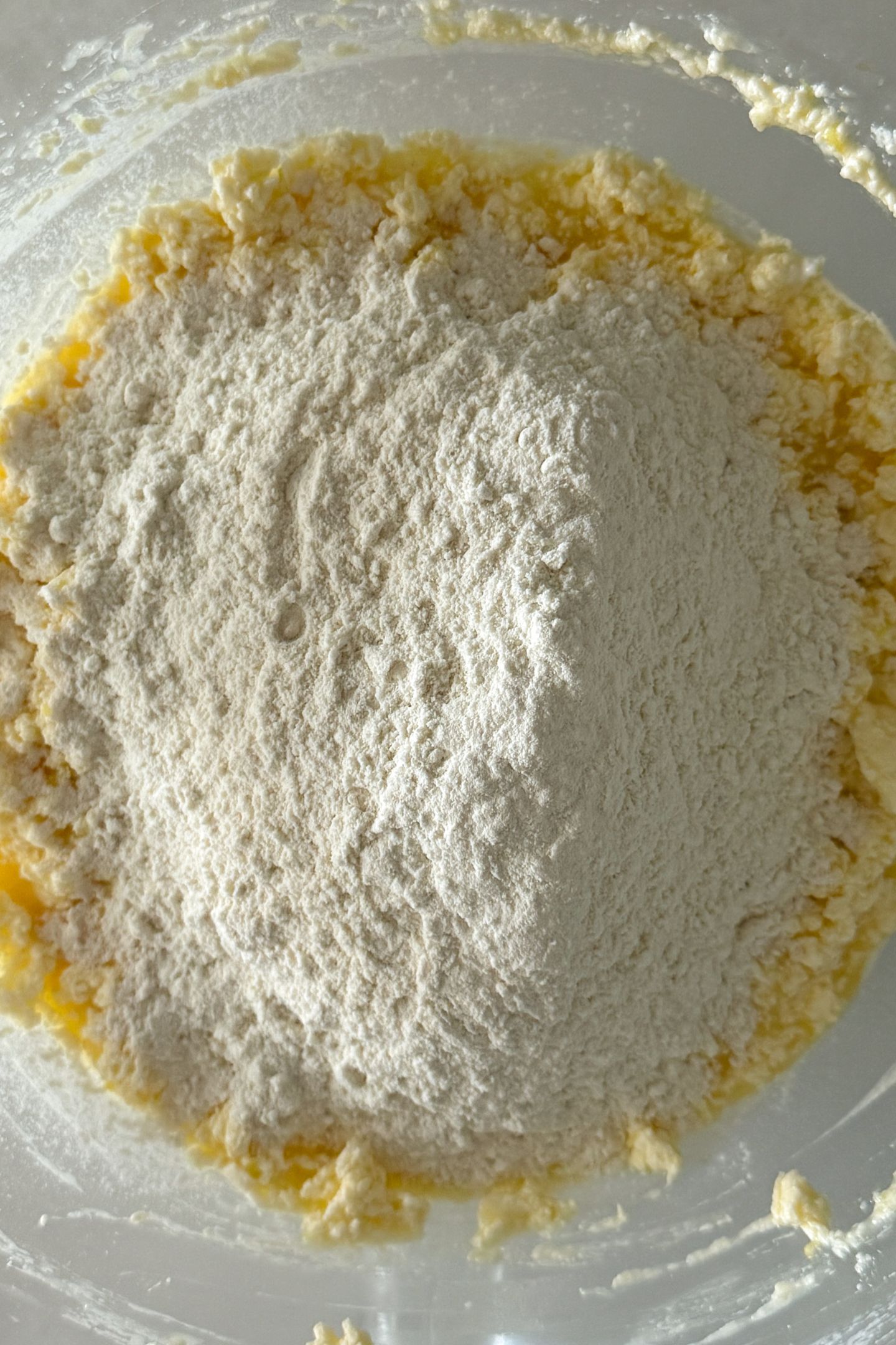 Adding flour to the wet ingredients.