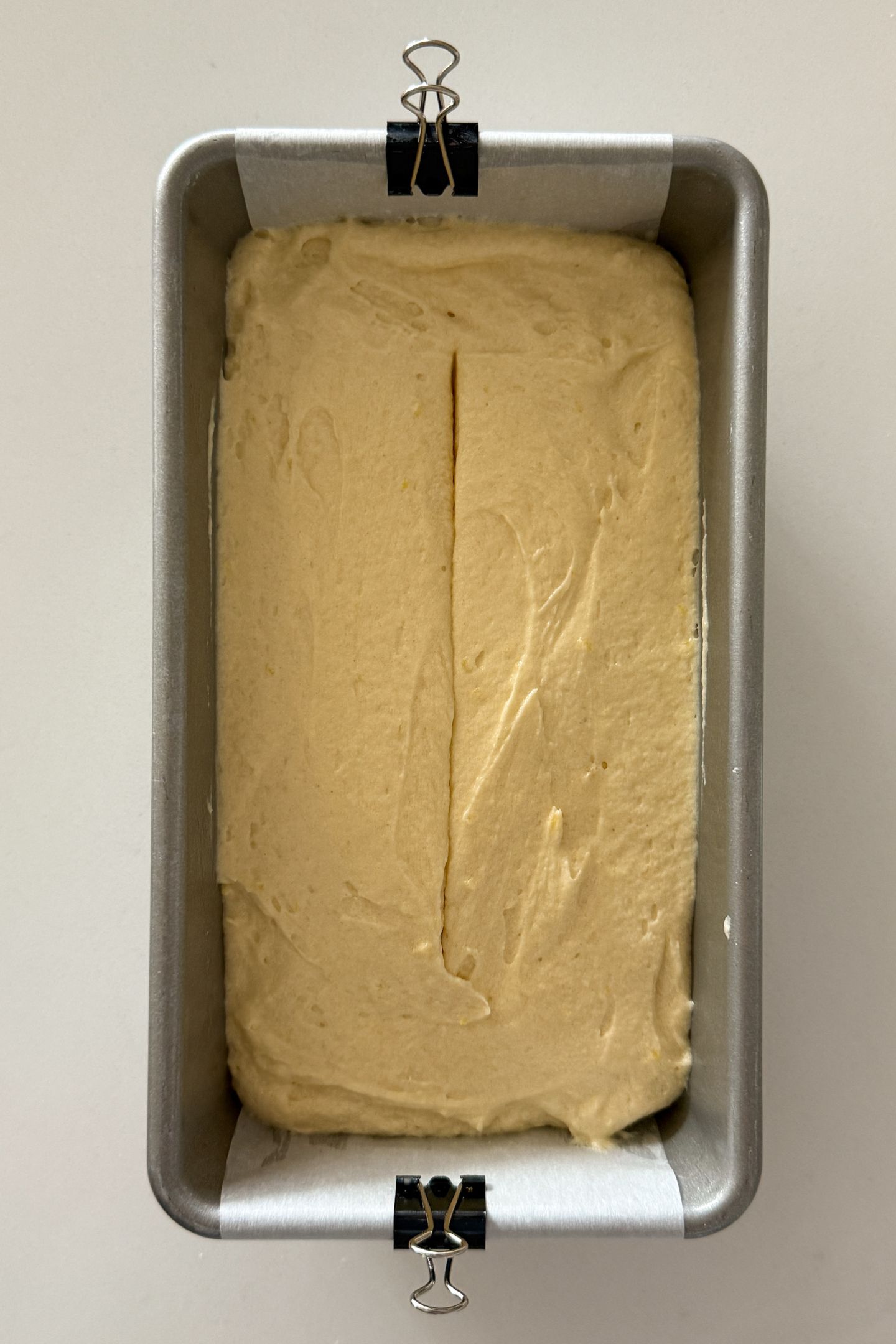 Pound cake batter in the prepared loaf pan.
