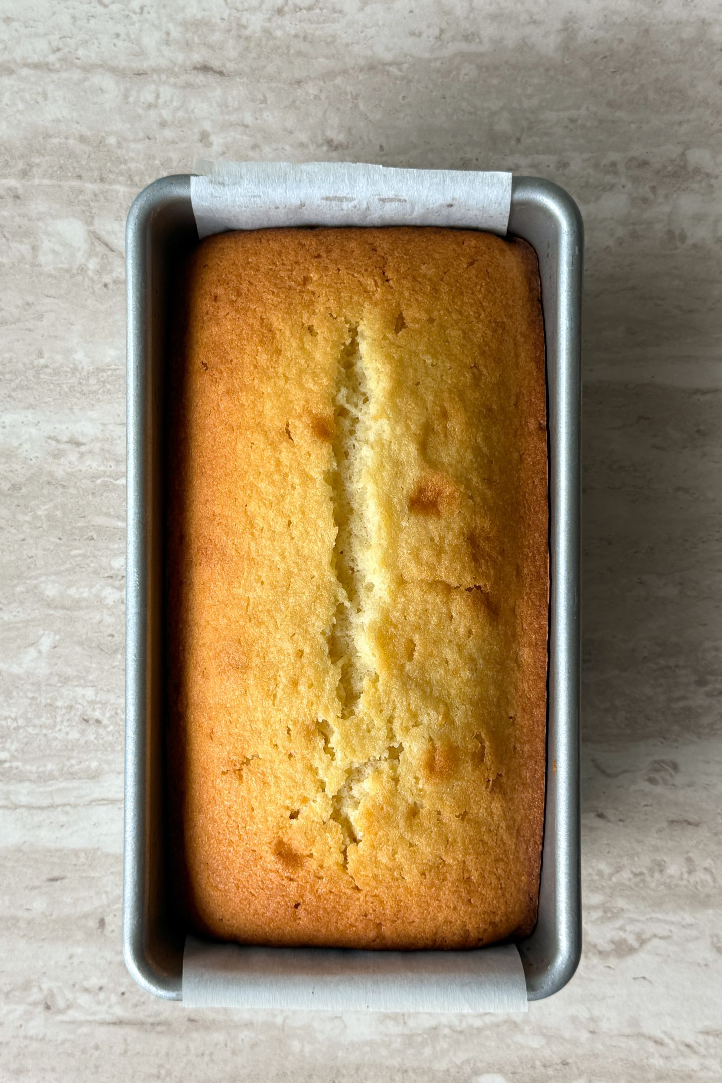 Baked lemon pound cake in the loaf pan.
