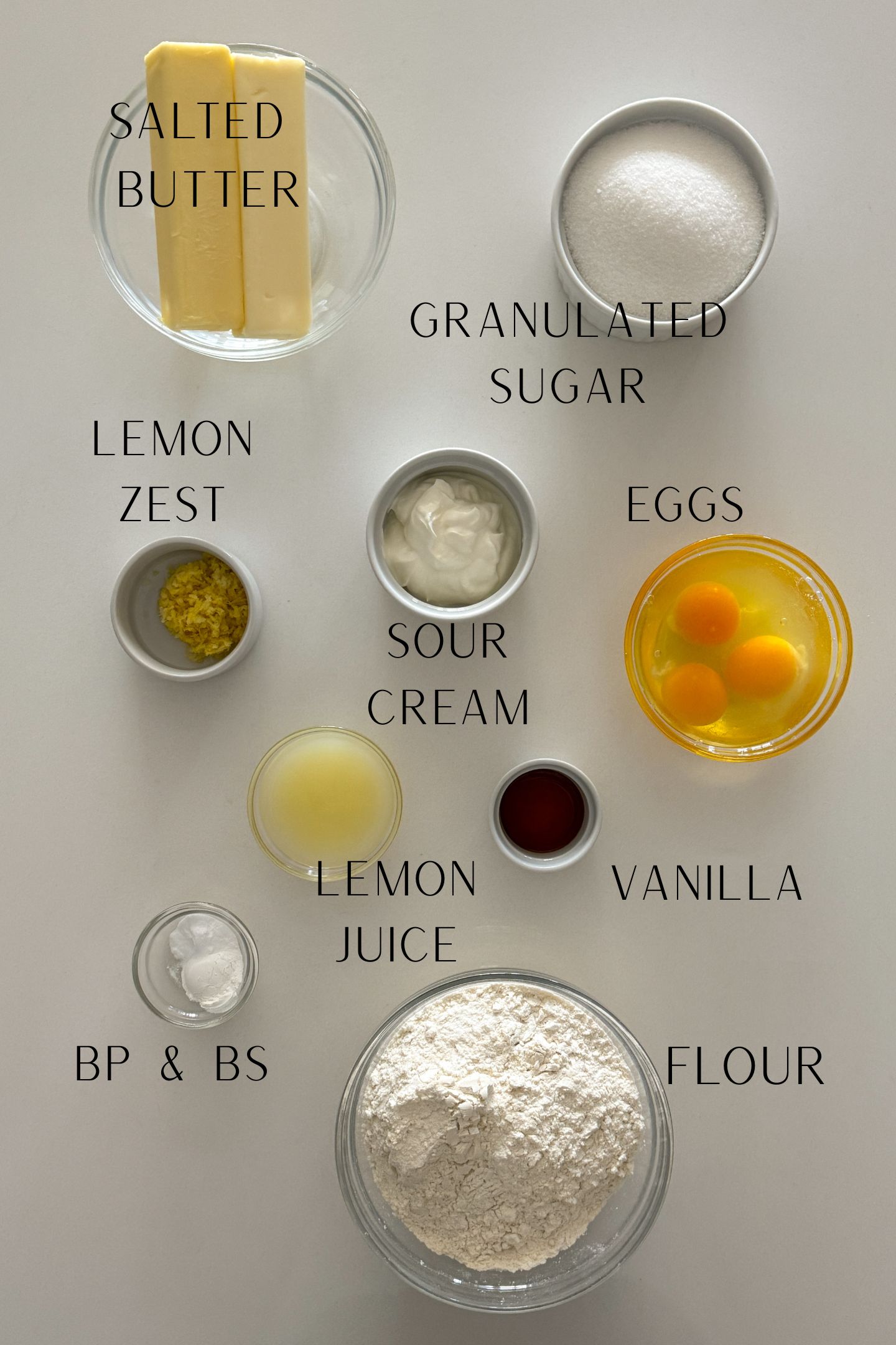 Ingredients measured out in bowls to make the lemon pound cake.