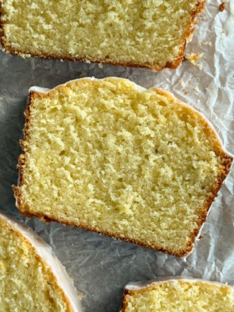 Slices of old fashioned lemon pound cake on a serving platter.