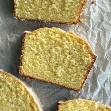 Slices of old fashioned lemon pound cake on a serving platter.