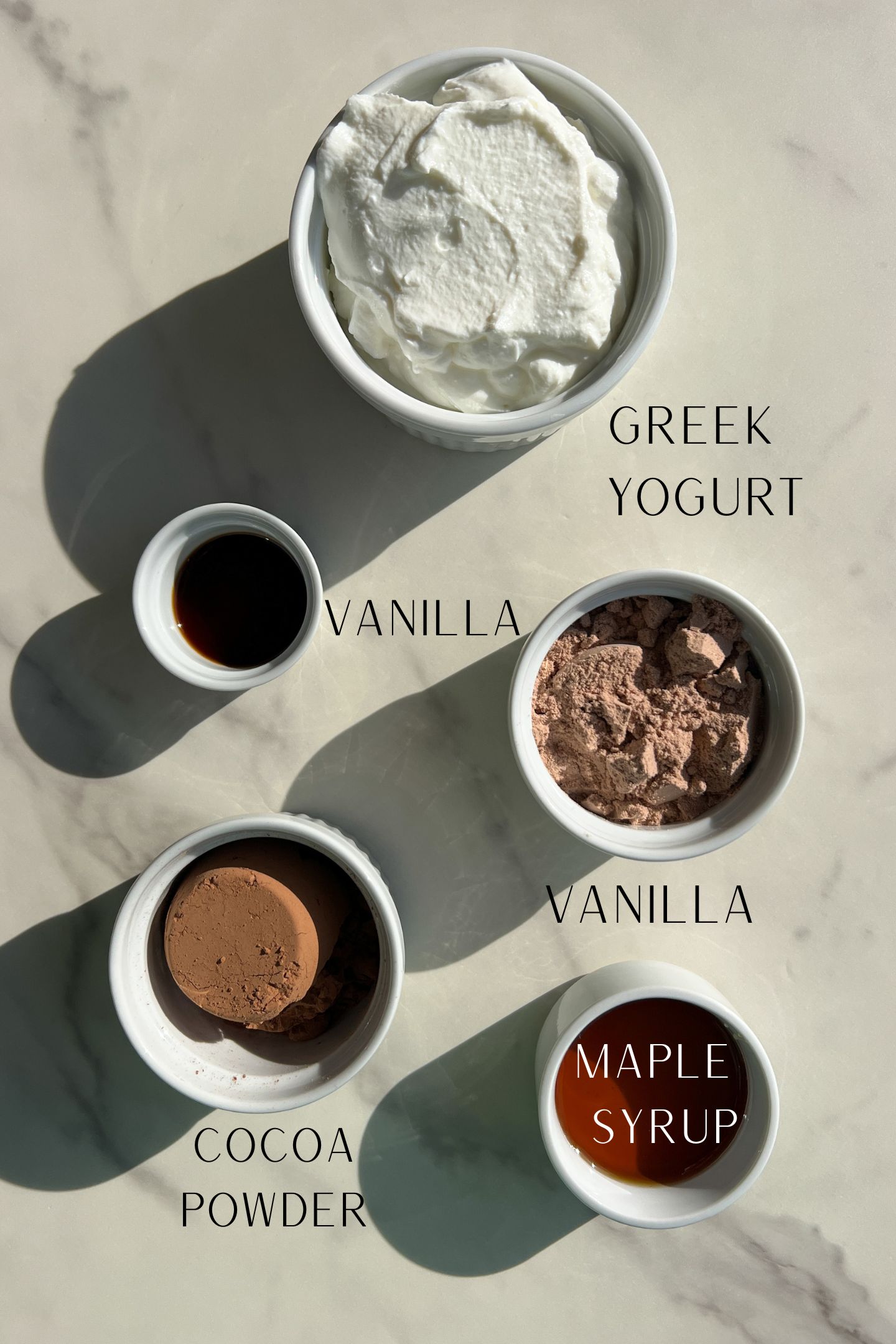 Protein Chocolate Mousse ingredients are measured out in bowls.