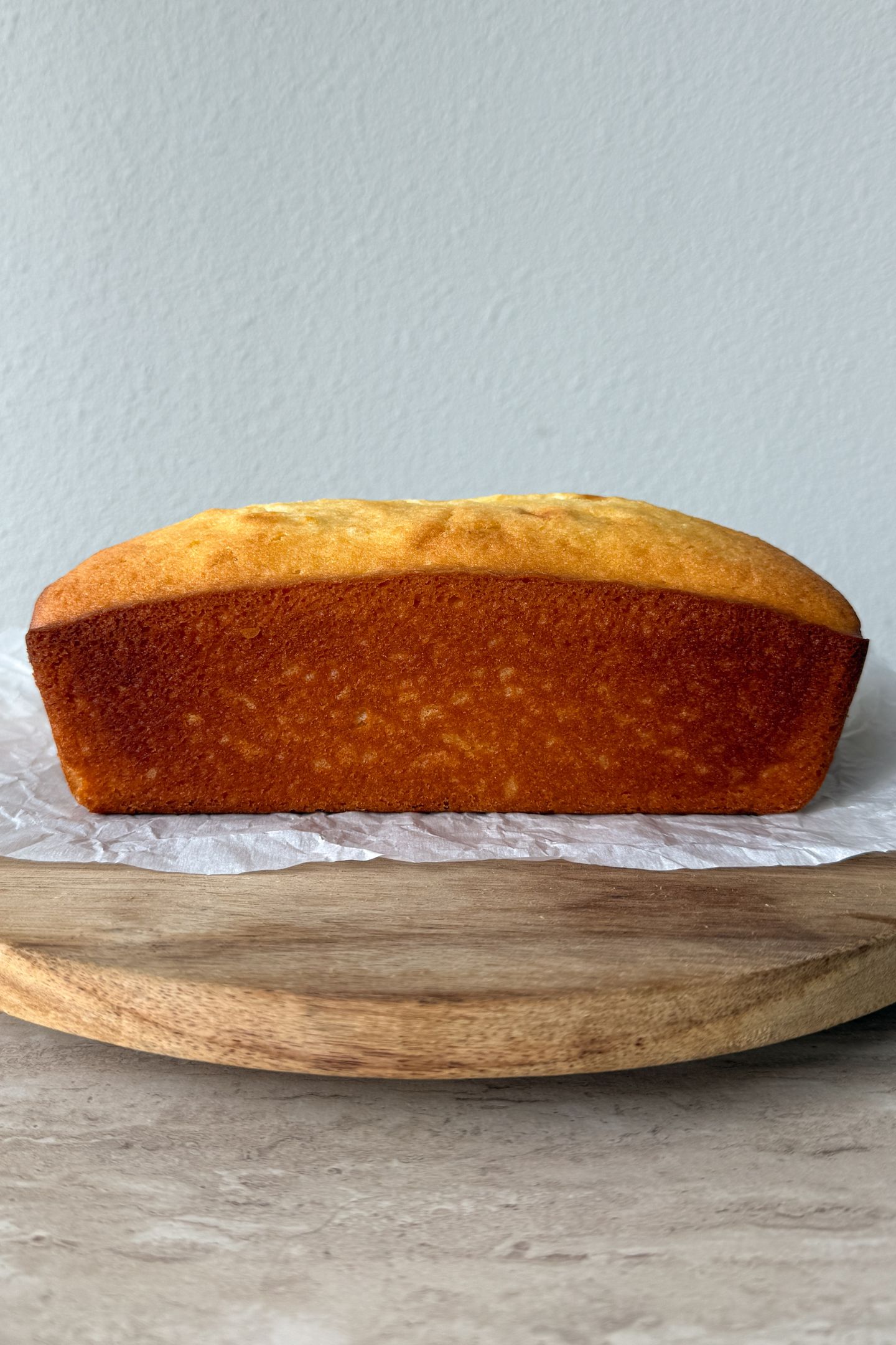 Cooled lemon pound cake on a platter.