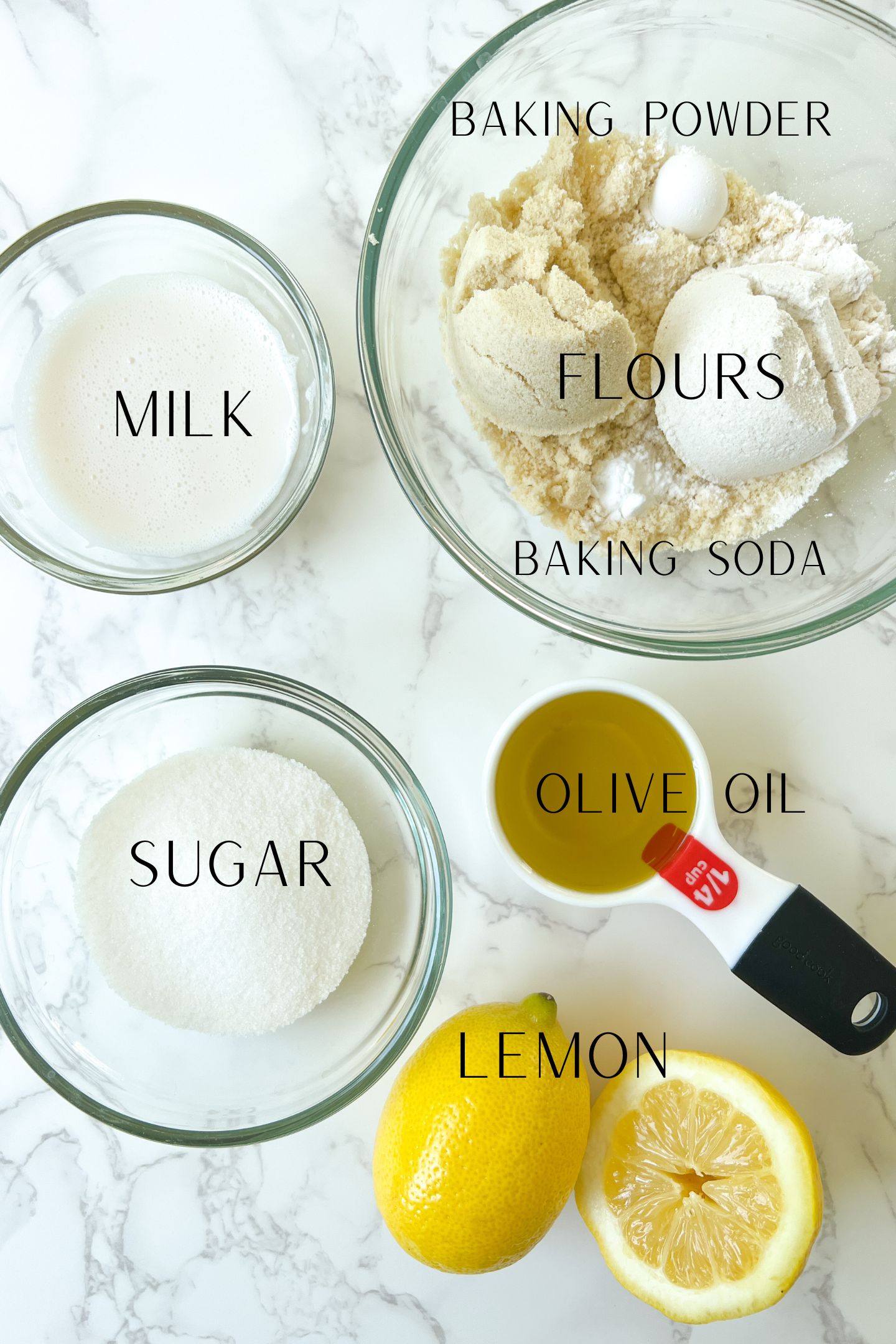 Vegan olive oil cake ingredients measured out ins bowls.