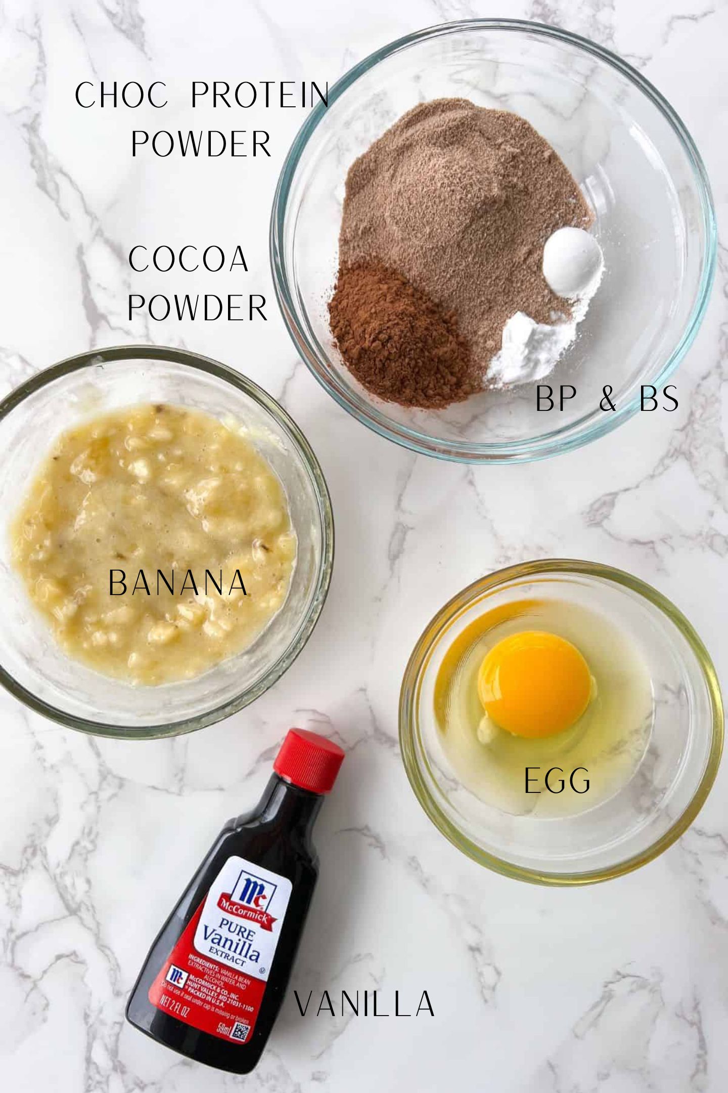 Ingredients measured out in bowls to make the protein mug cake.