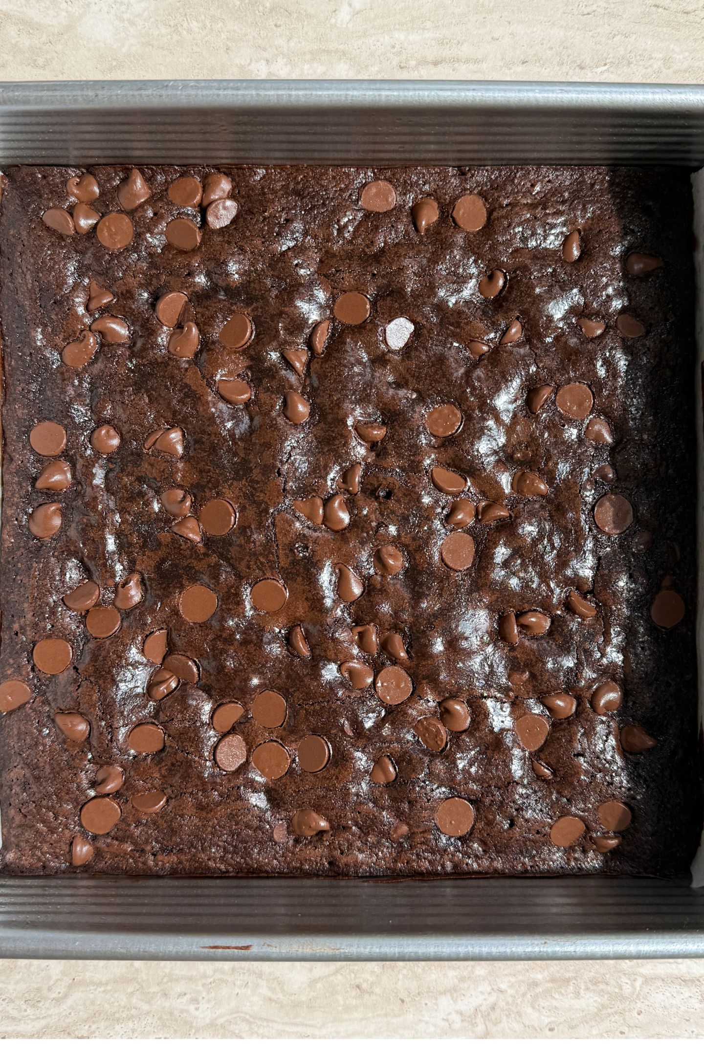 Baked espresso brownies in a square baking pan.