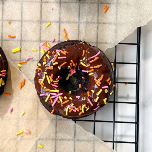 Brownie Donuts with Chocolate Frosting and topped with sprinkles.