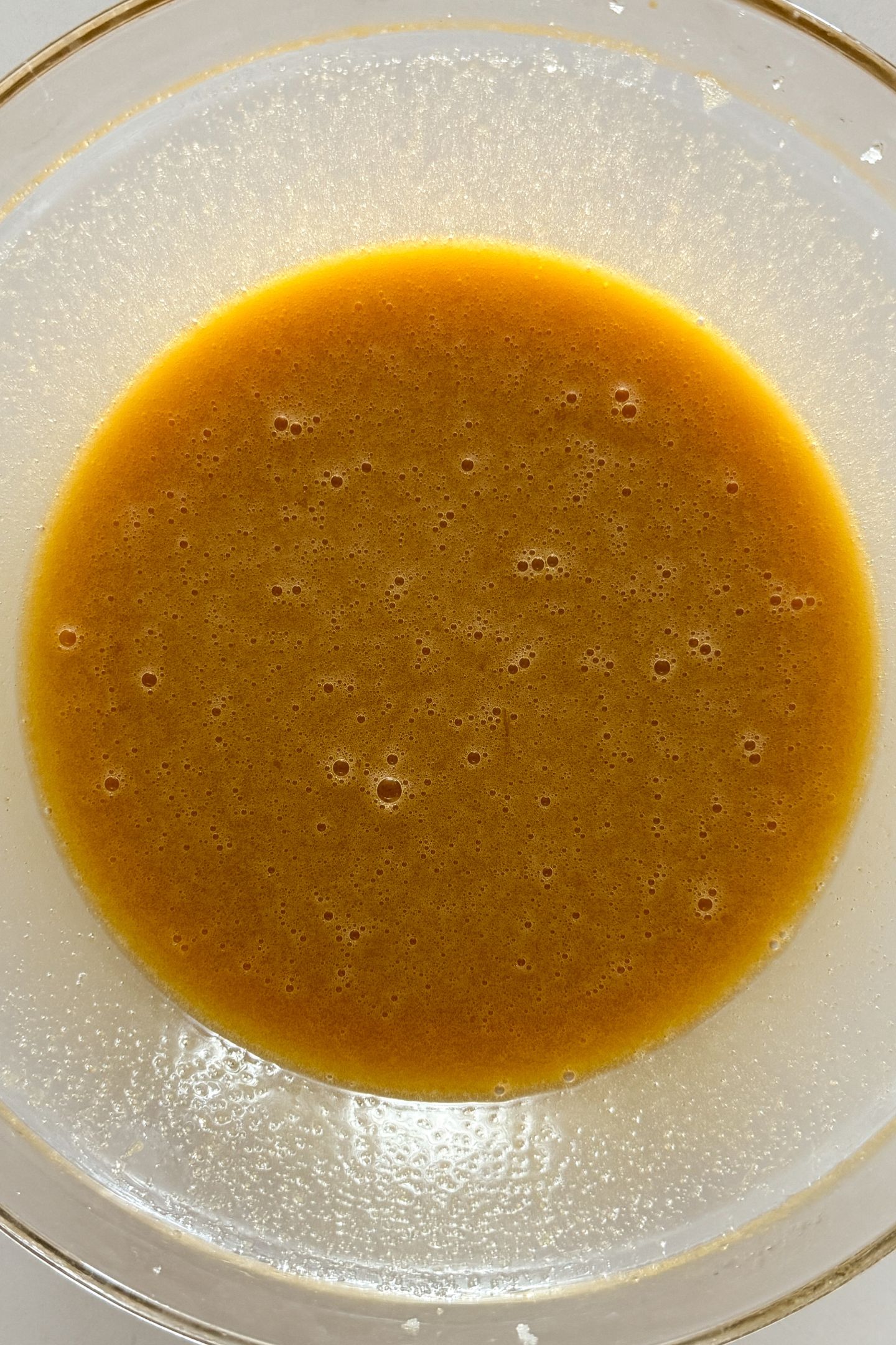 All of the wet ingredients mixed together in the mixing bowl.
