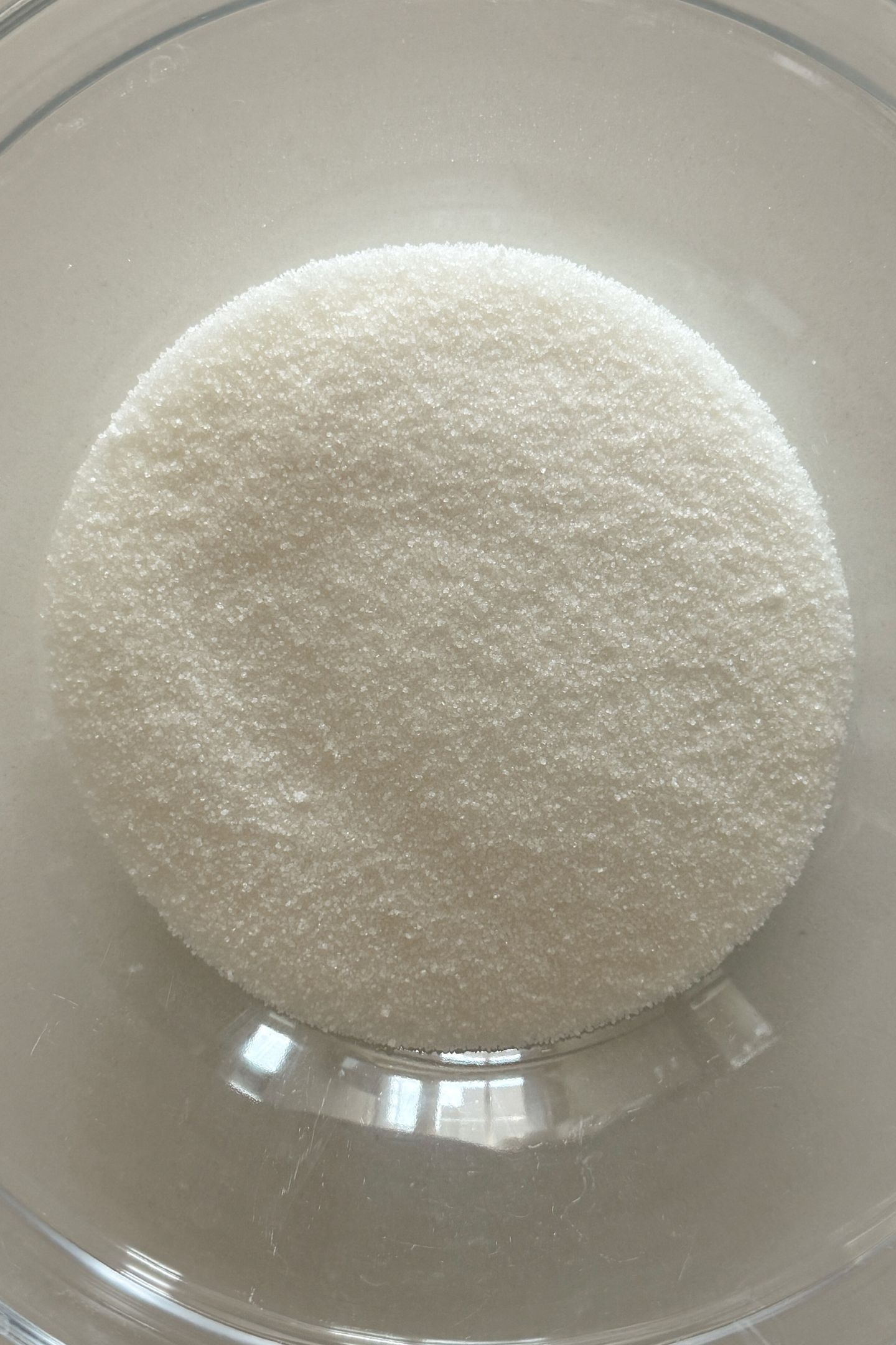 Granulated sugar in a mixing bowl.