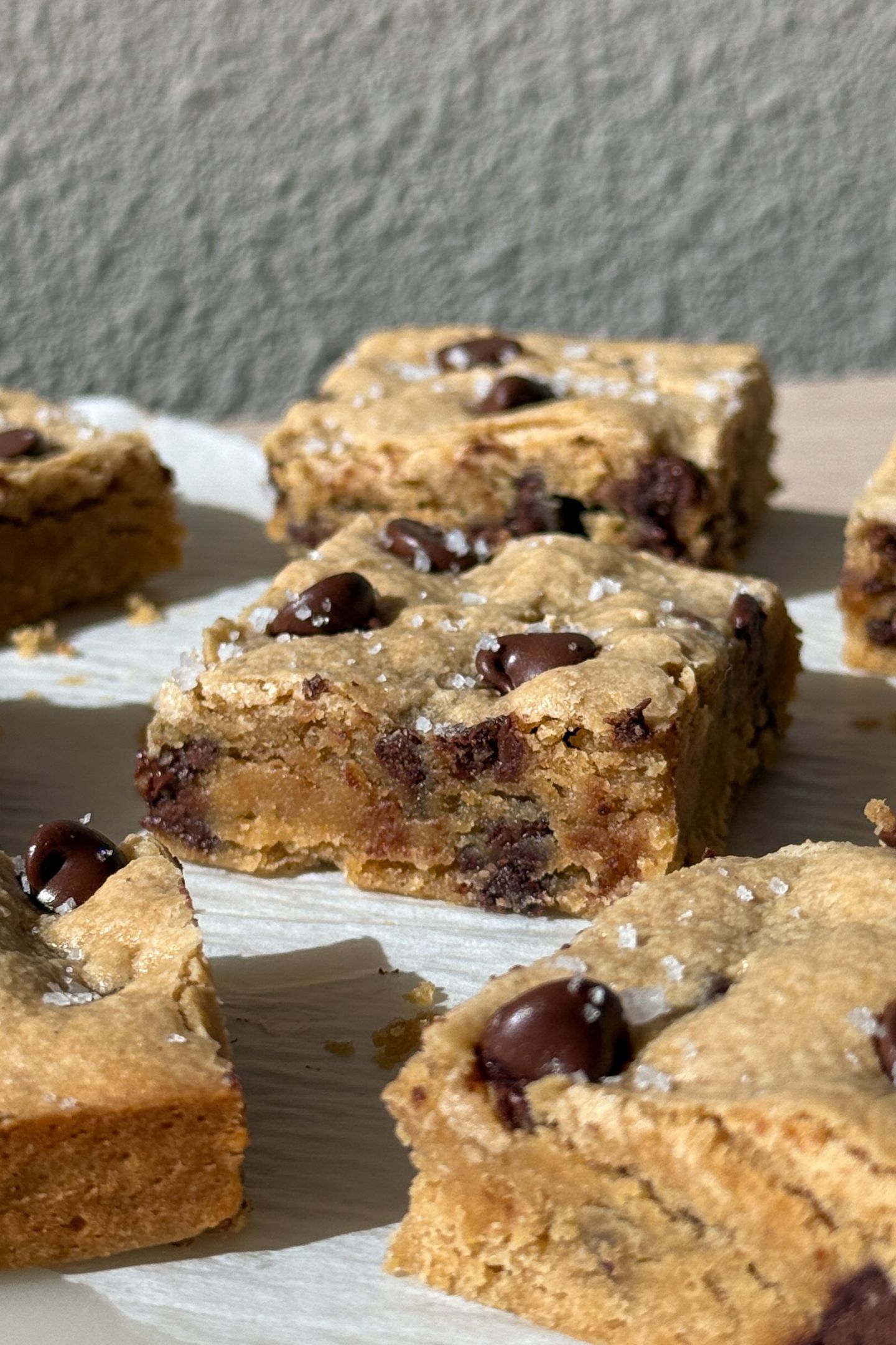 Side view of a gluten free blondie on a plate.