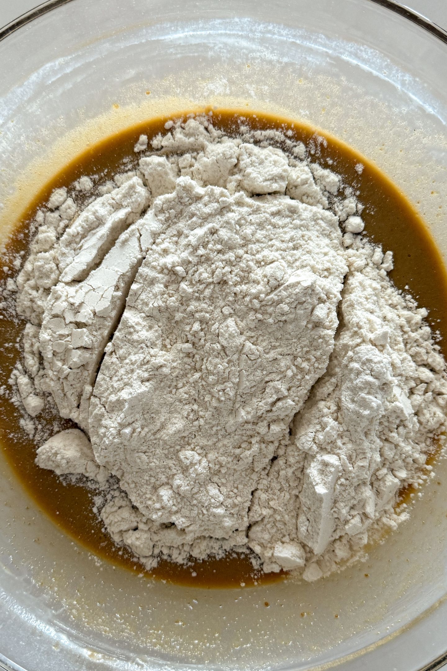Adding the flour to the wet ingredients.