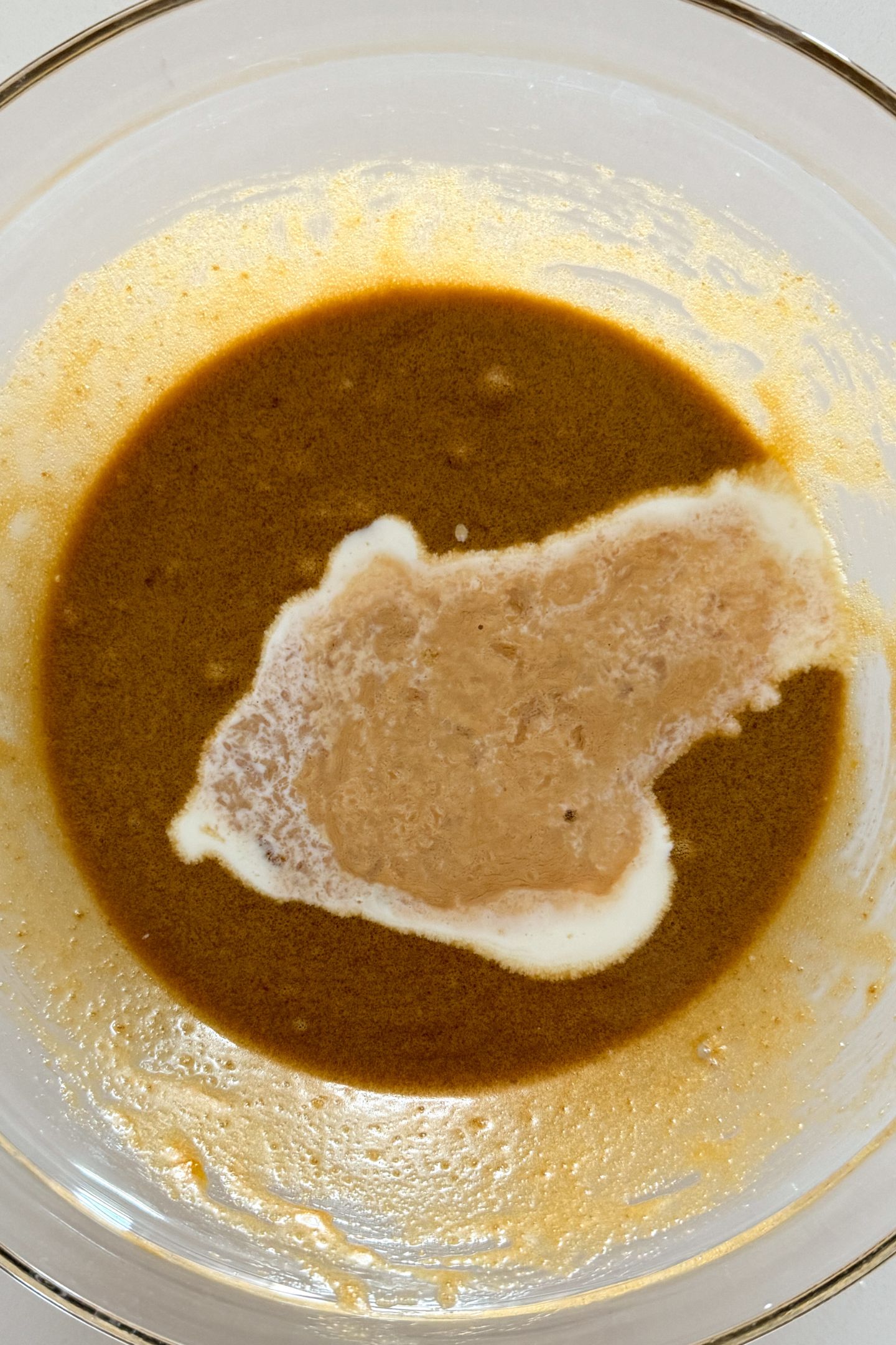 Wet ingredients mixed together in a large mixing bowl.