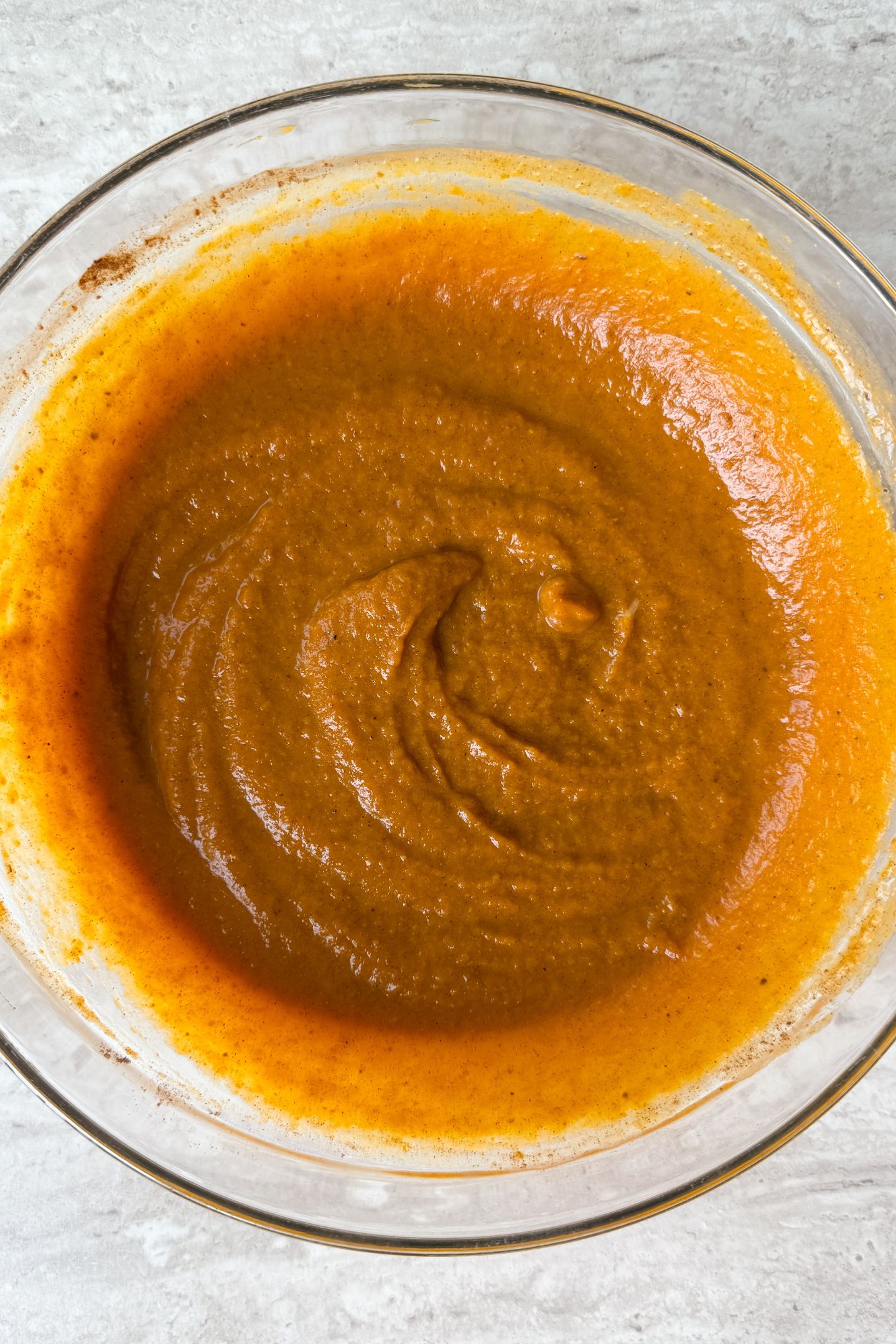 The pumpkin pie filling in a mixing bowl.