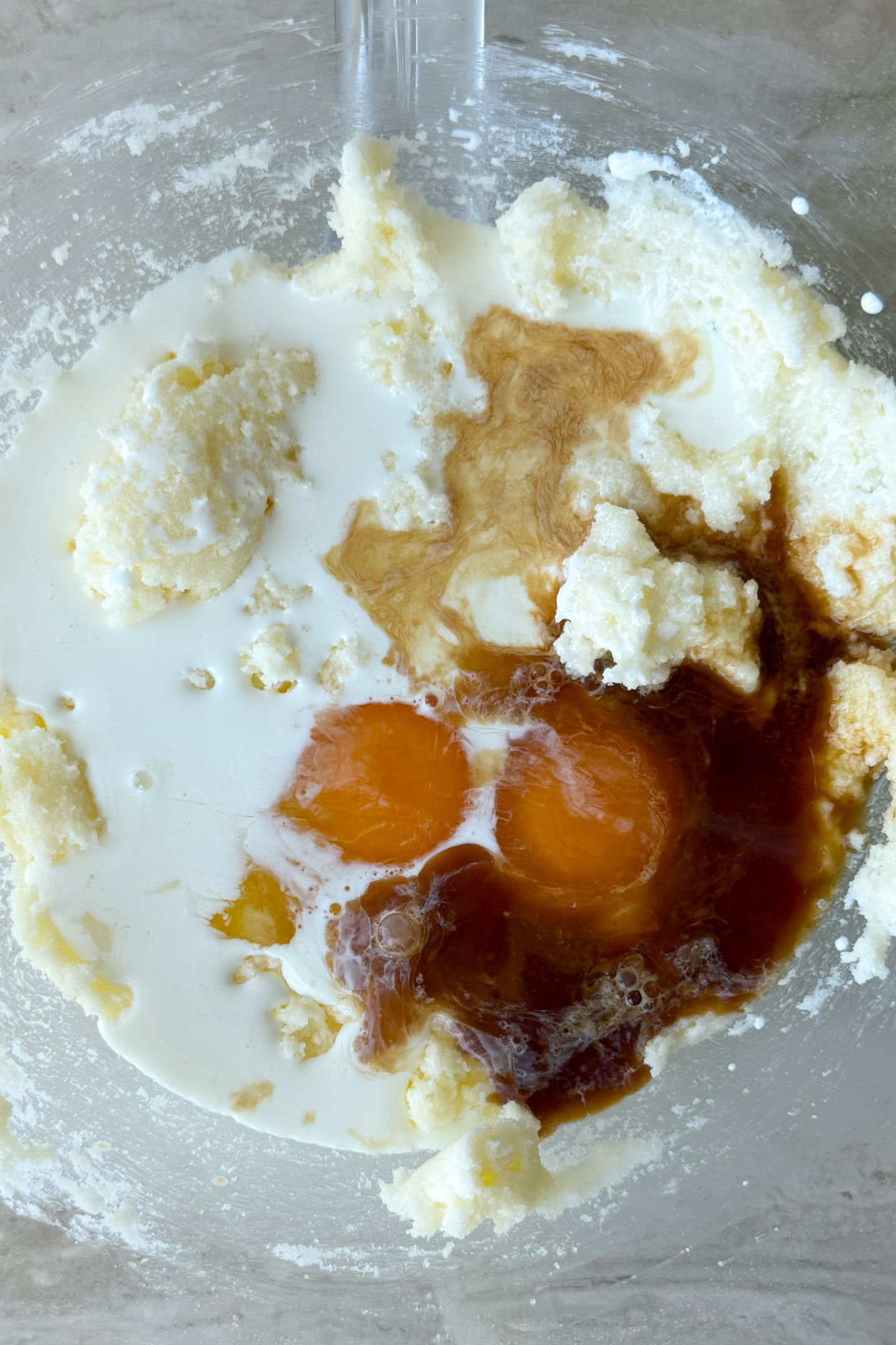 Combining wet ingredients together in a bowl.