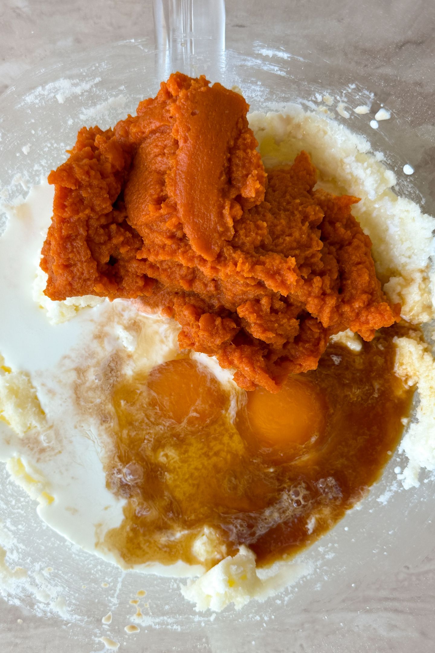 Combining wet ingredients together in a bowl.