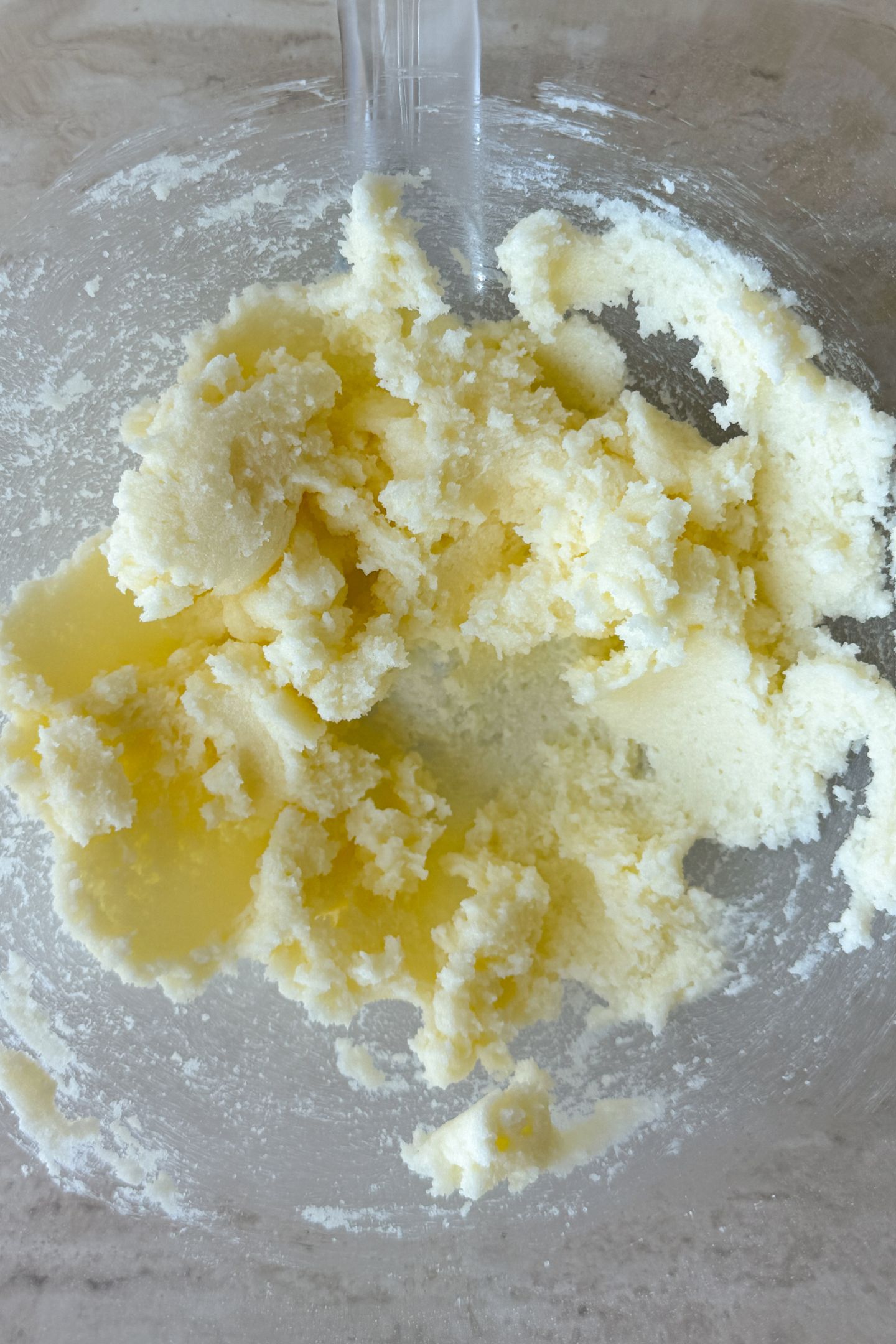 Creaming butter and sugar together in a bowl.