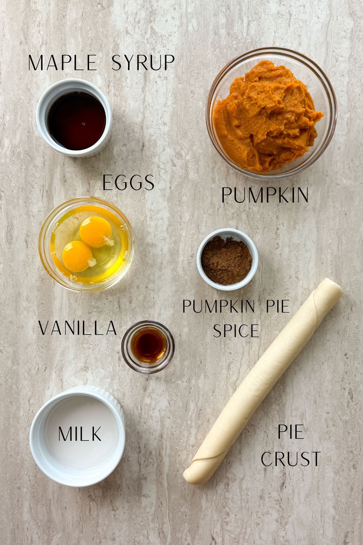 Ingredients measured out in bowls to make the mini pumpkin pies.