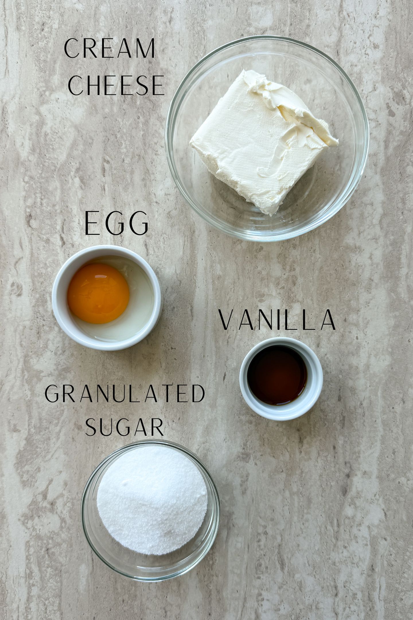 Ingredients measured out in bowls to make the cheesecake swirl.