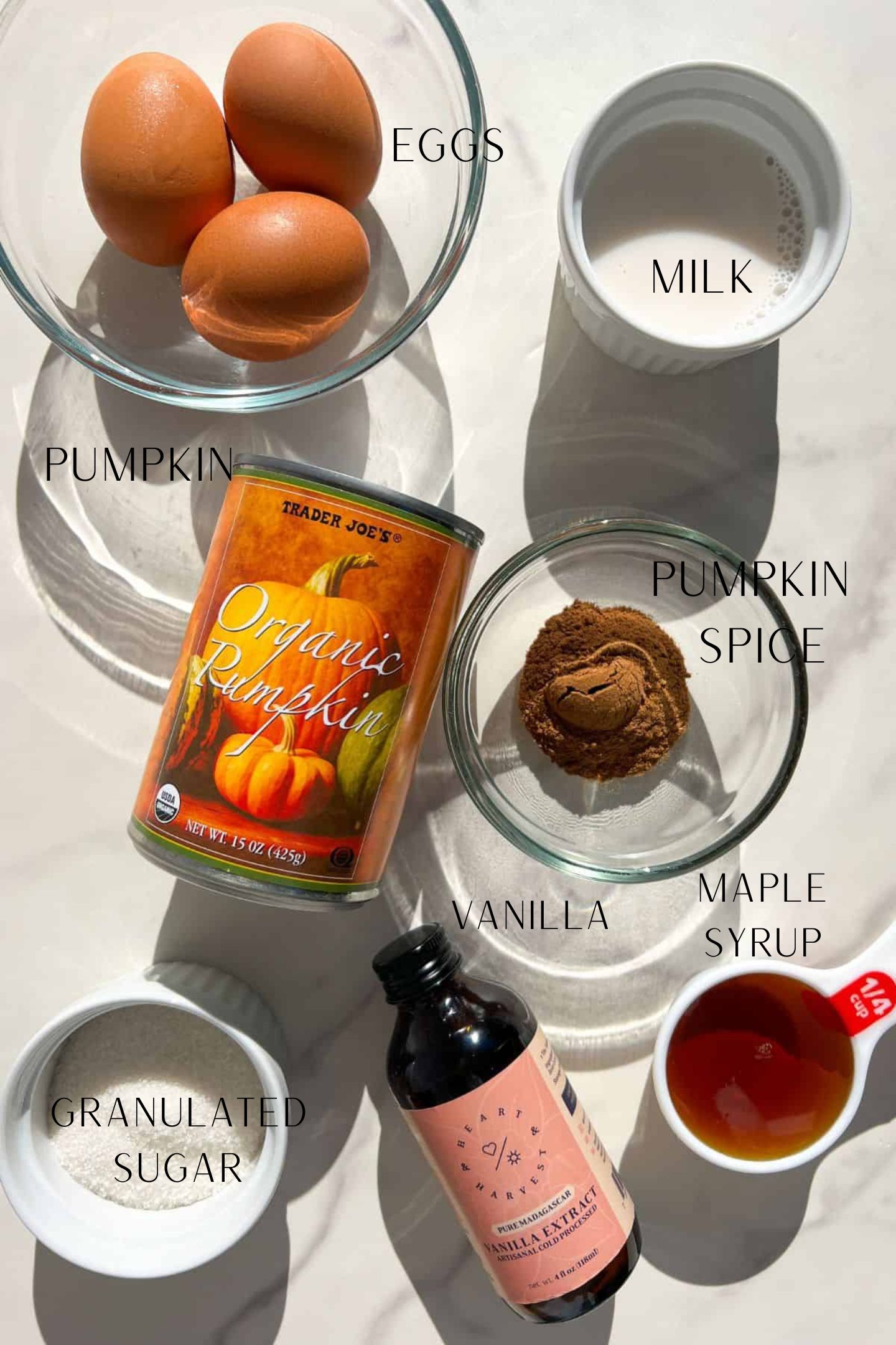 Ingredients to make mini pumpkin pie with puff pasty in glass bowls.