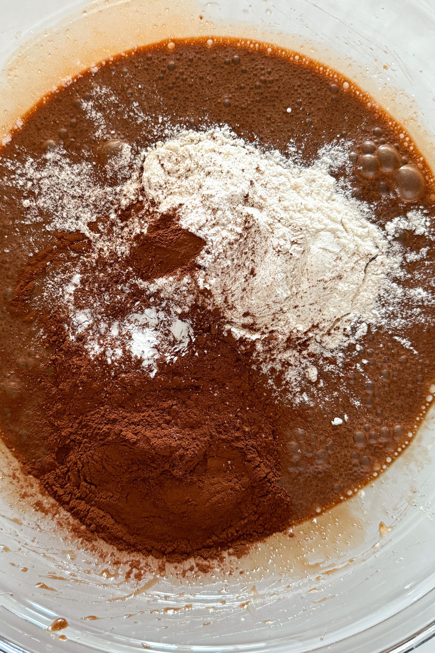 Dry ingredients added on top of the mixed wet ingredients.