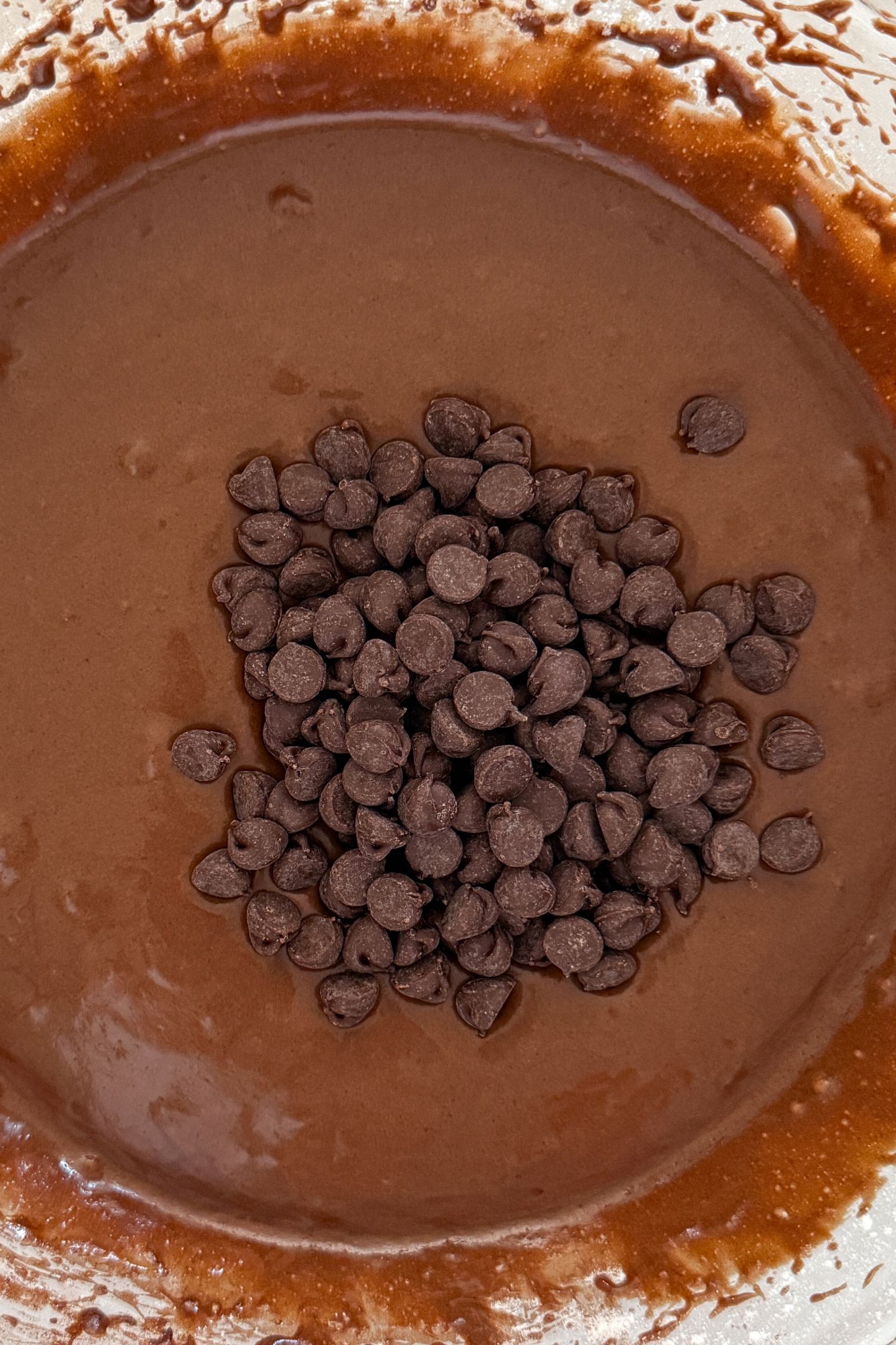 Chocolate chips added on top of the brownie cookie batter.