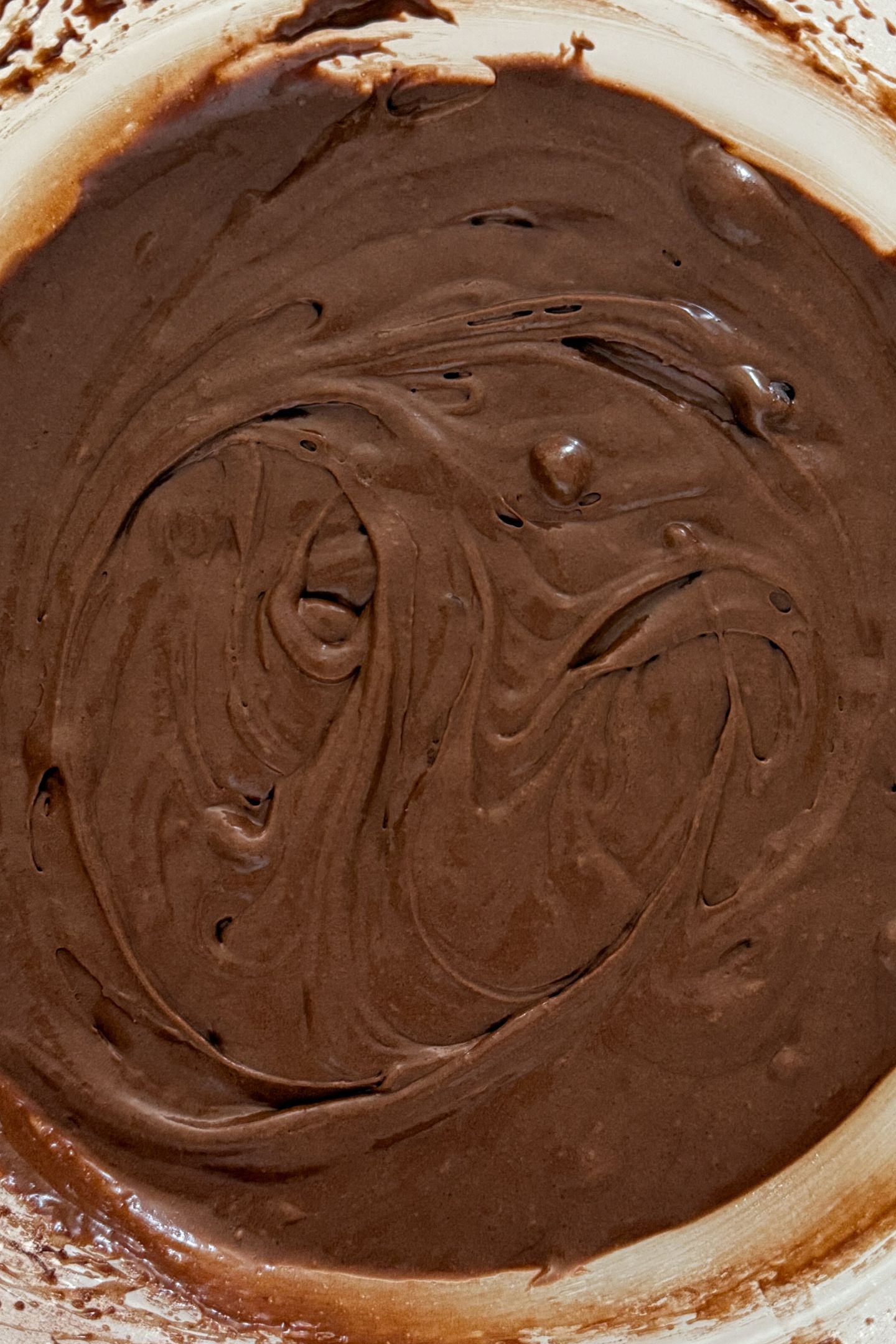 Mixed brownie cookie batter in a bowl.