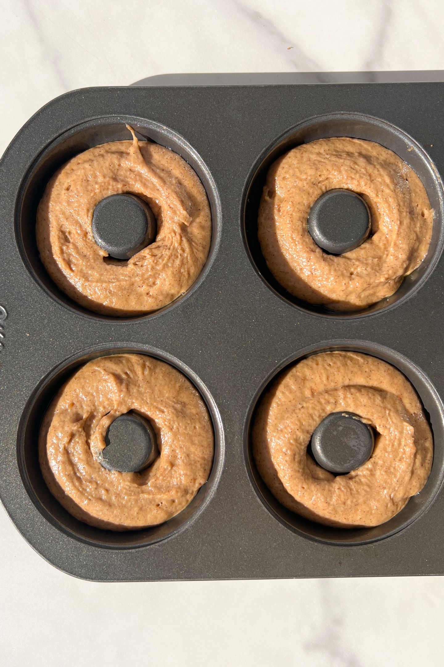 Donut butter in a greased donut pan