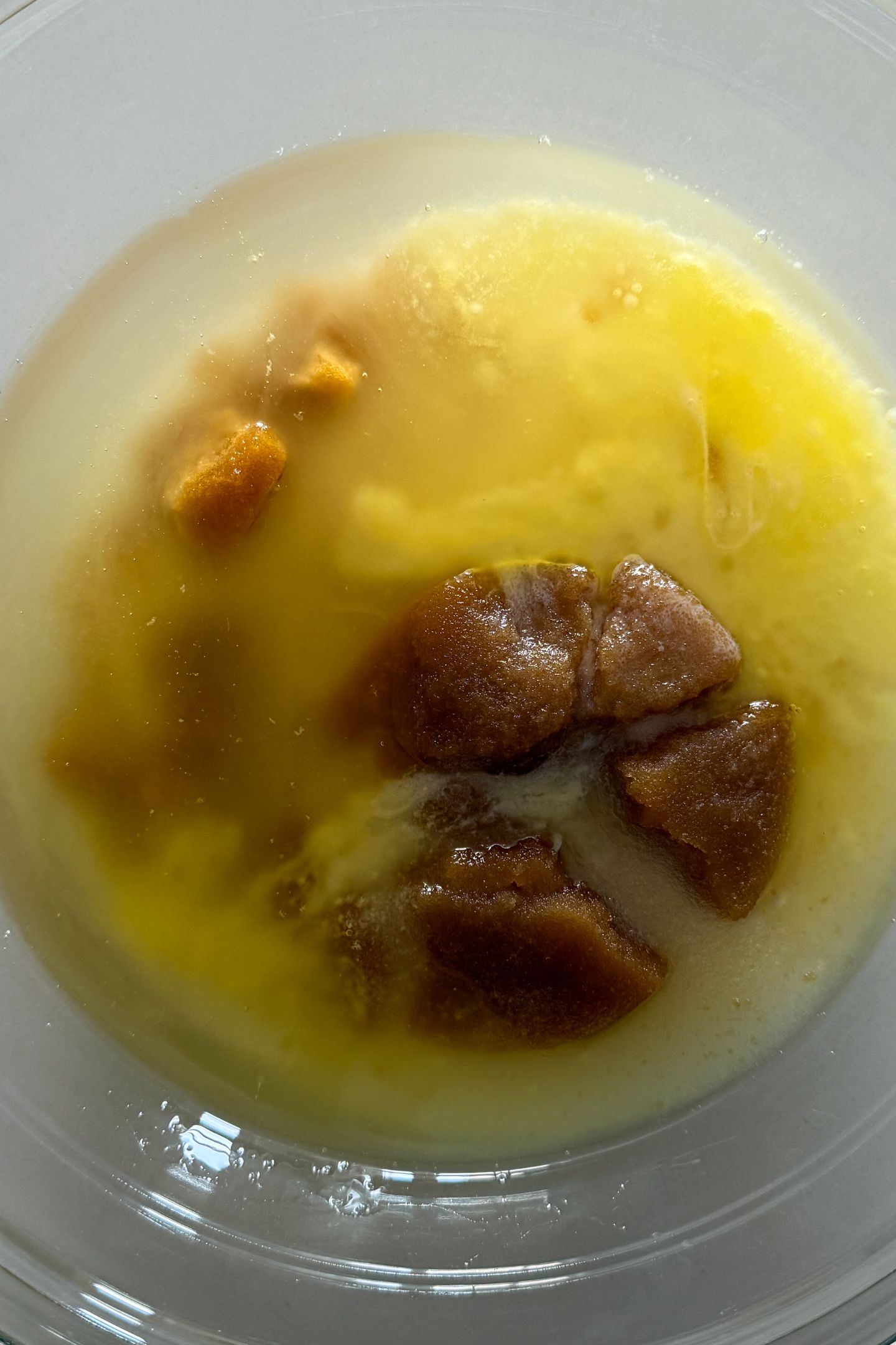 Granulated and brown sugar in a mixing bowl with the butter and oil.