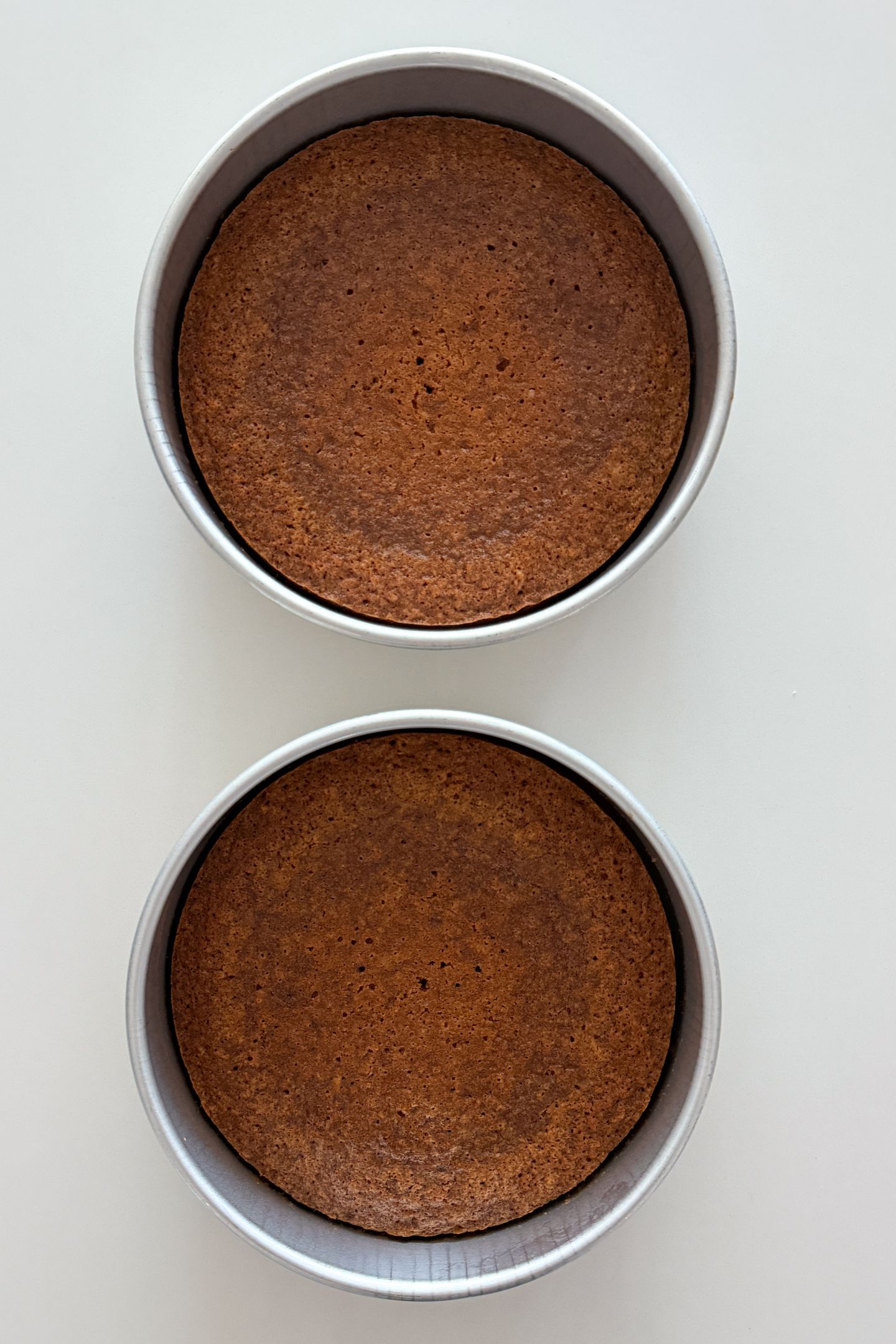 Carrot cake in cake pans.