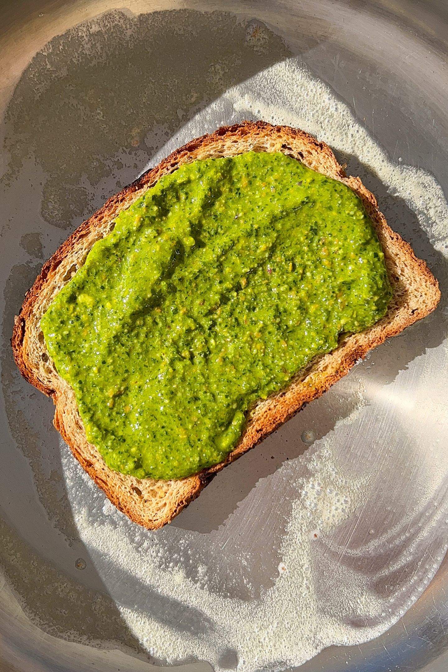 Spinach Pesto spread on the slice of bread