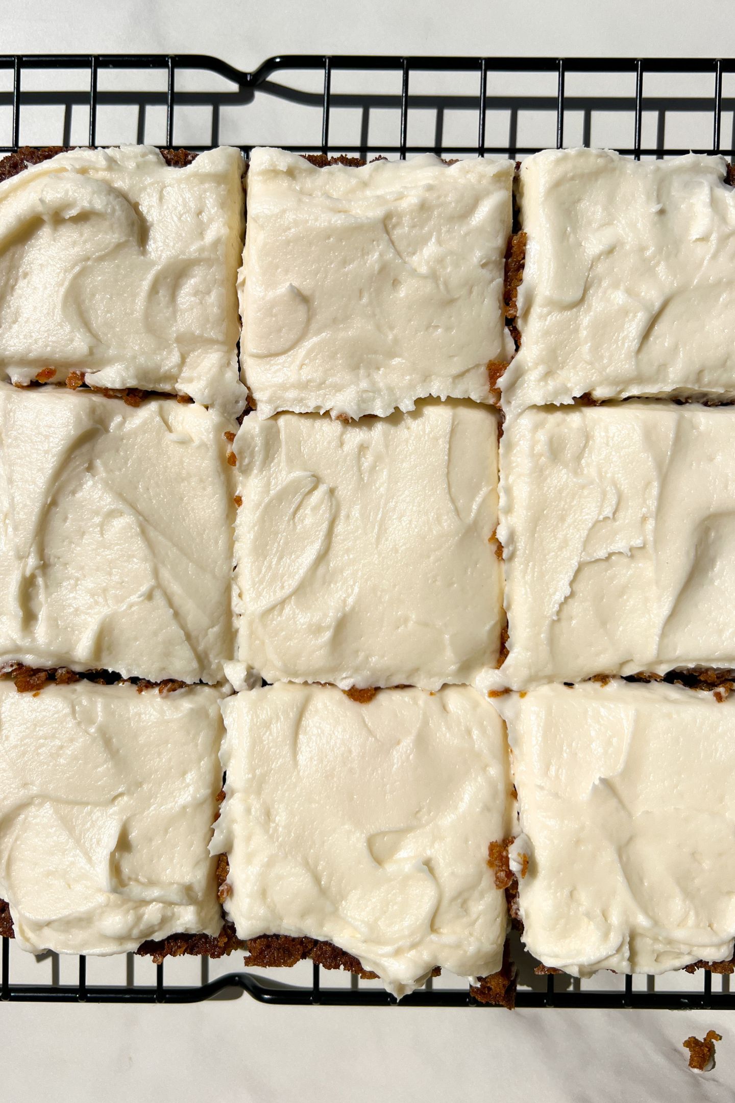 Sliced Carrot Cake topped with a cream cheese frosting