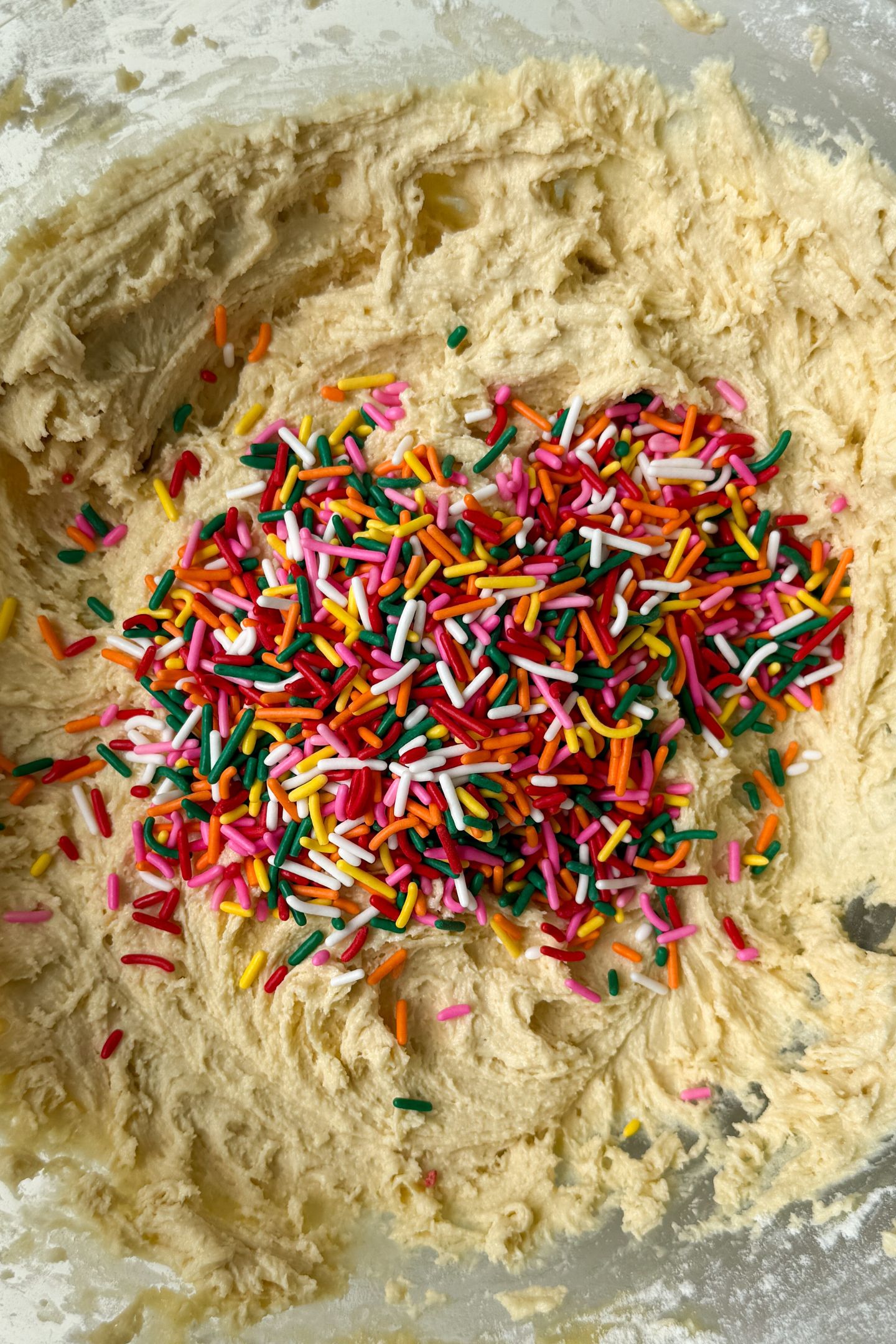 Sprinkles on top of the cookie batter.
