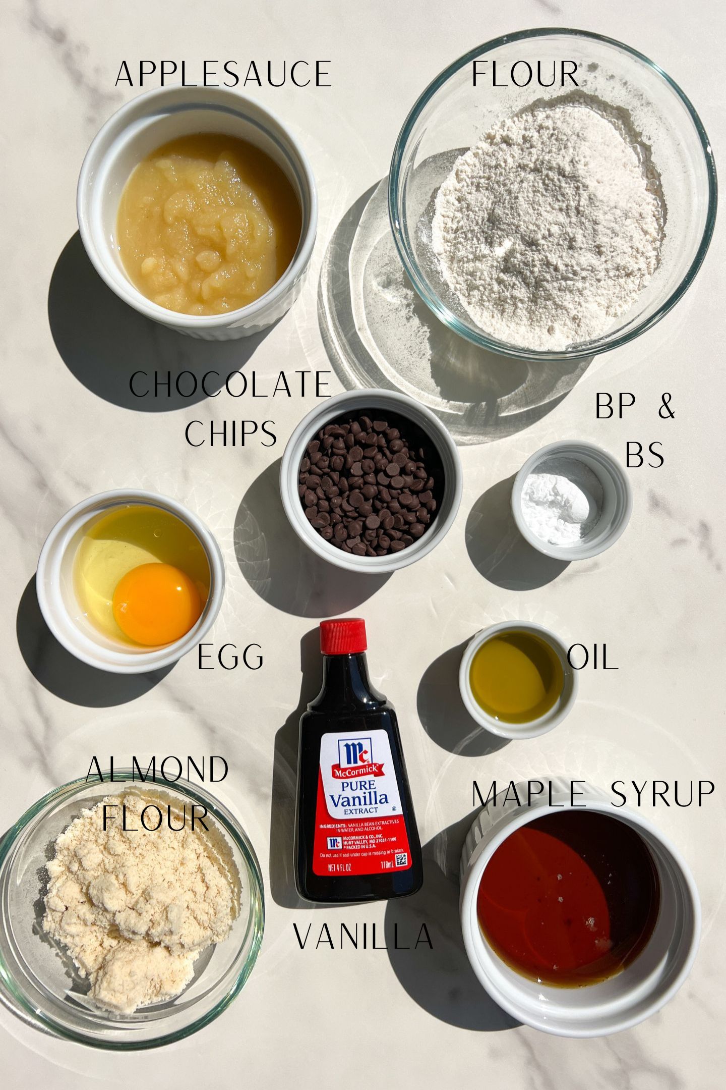 Ingredients measured out in bowls to make Choc Chip Mini Muffins.