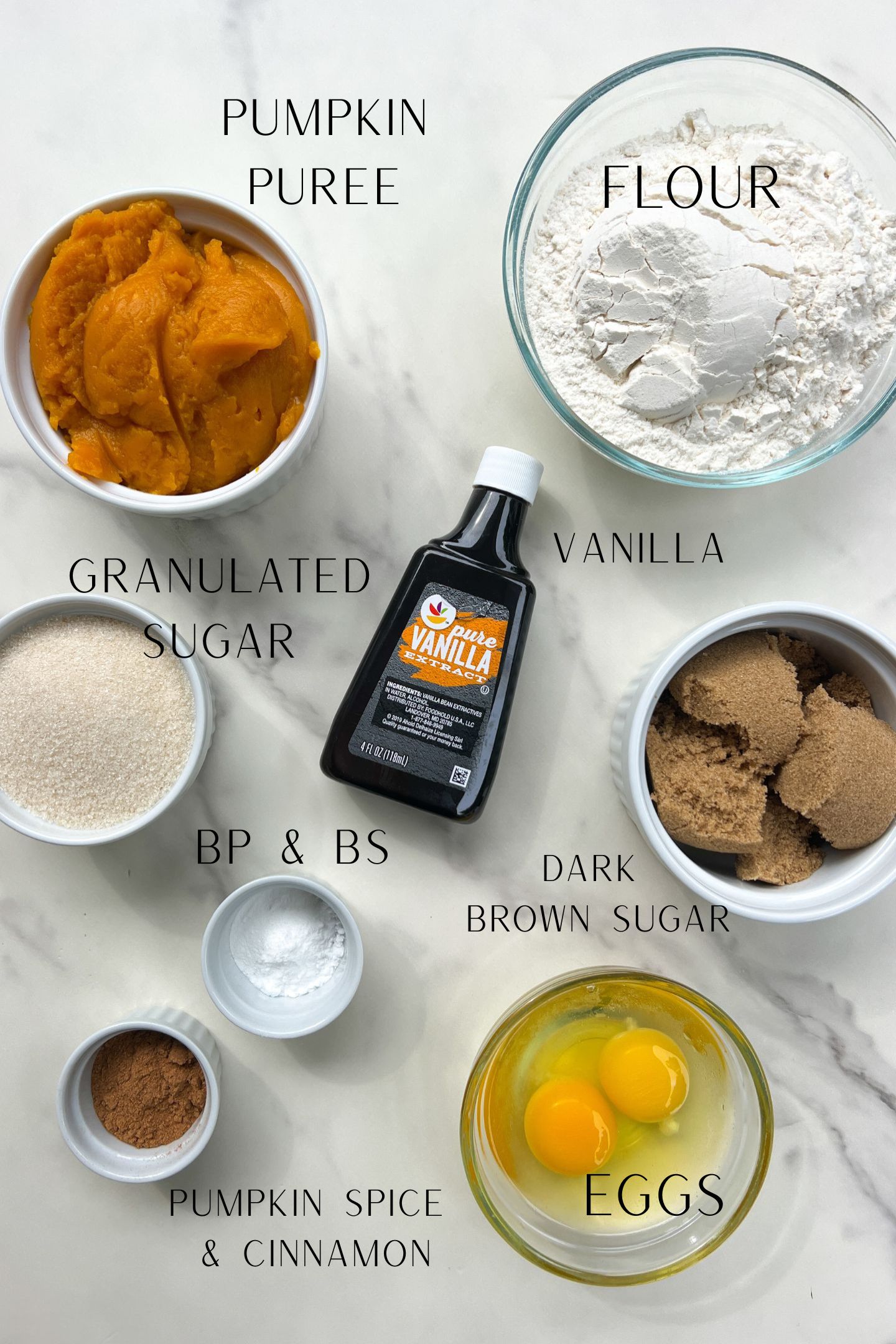 Ingredients measured out in bowls to make the mini pumpkin muffins.