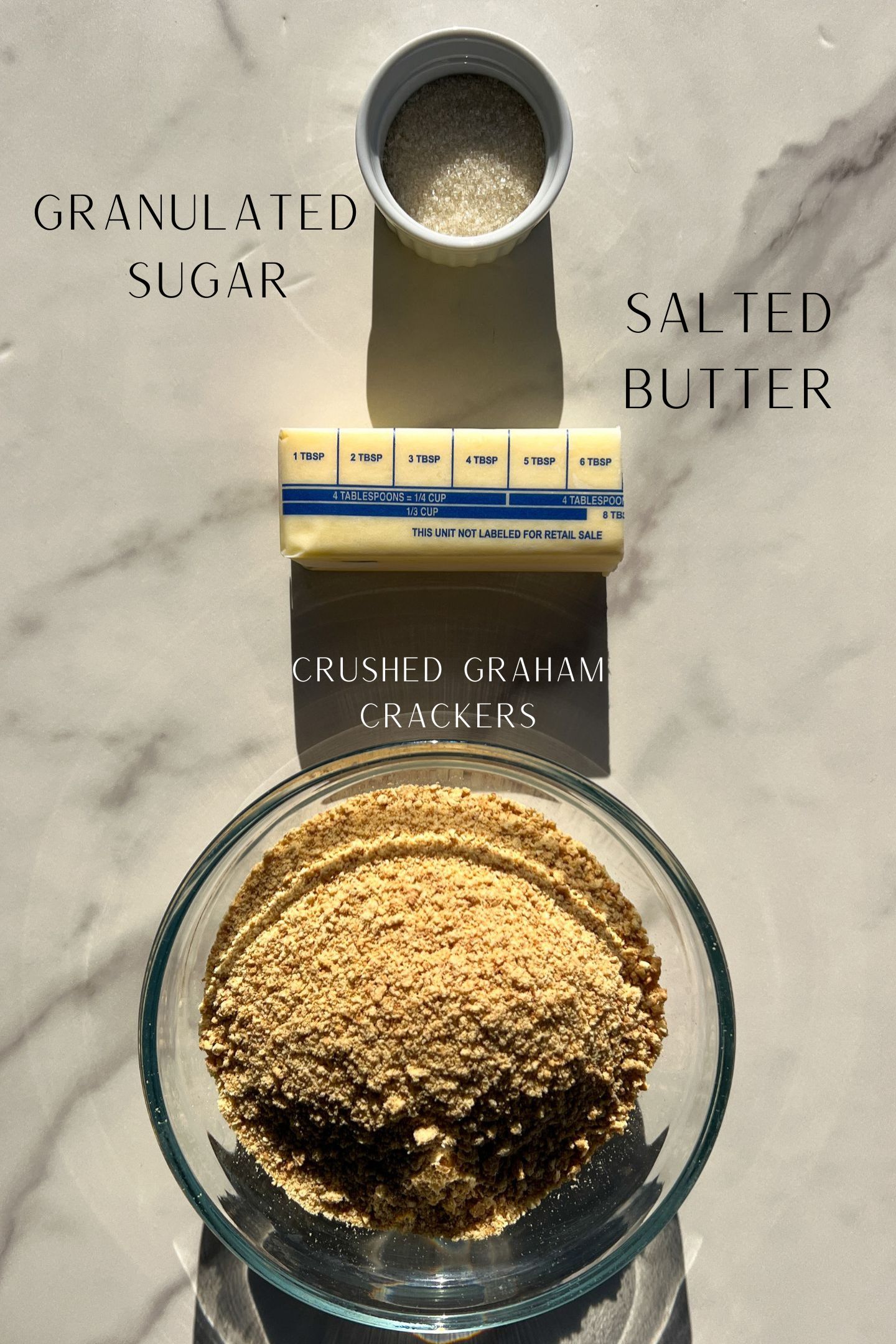 Graham cracker crust ingredients in bowls.