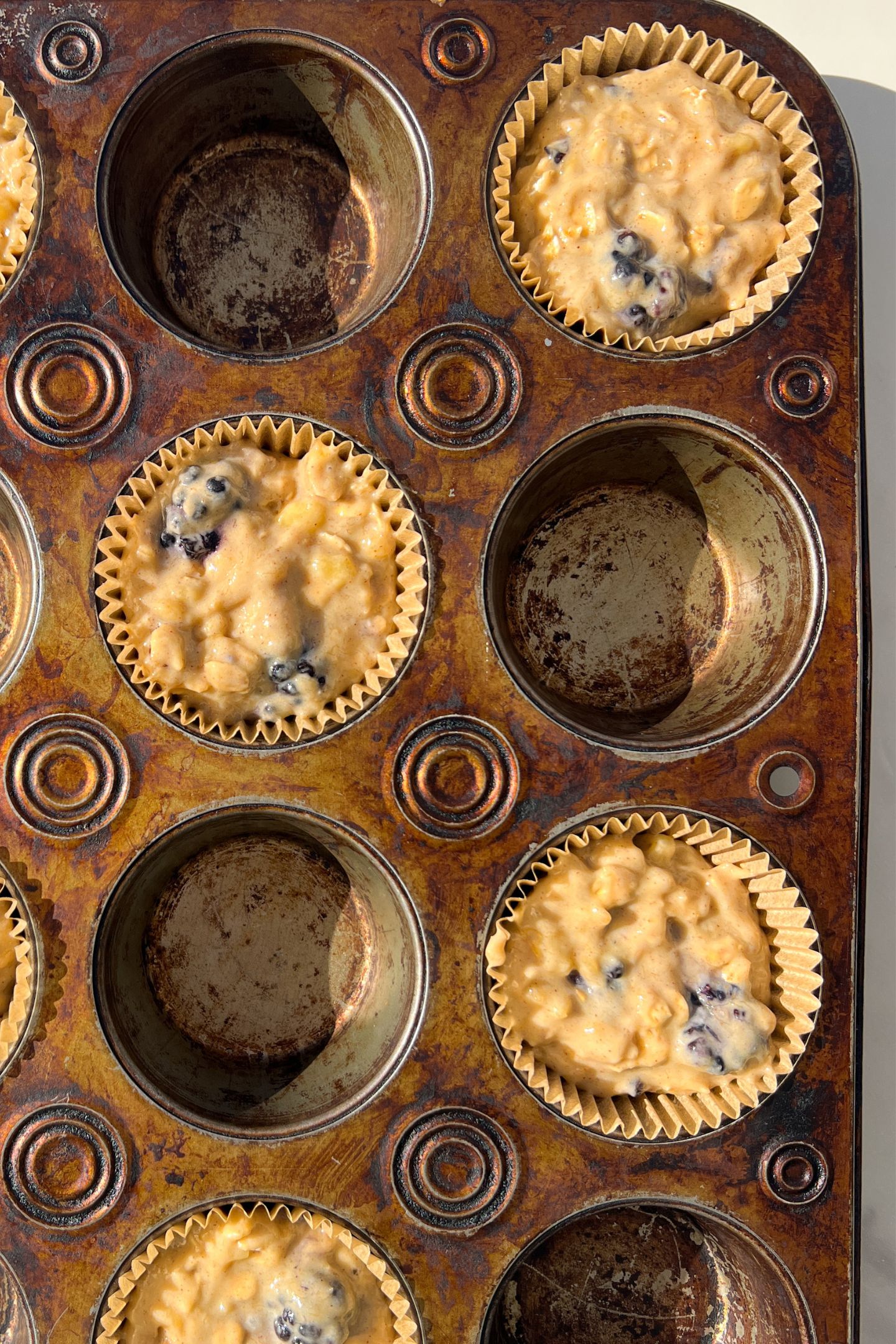 Muffin batter in muffin liners.