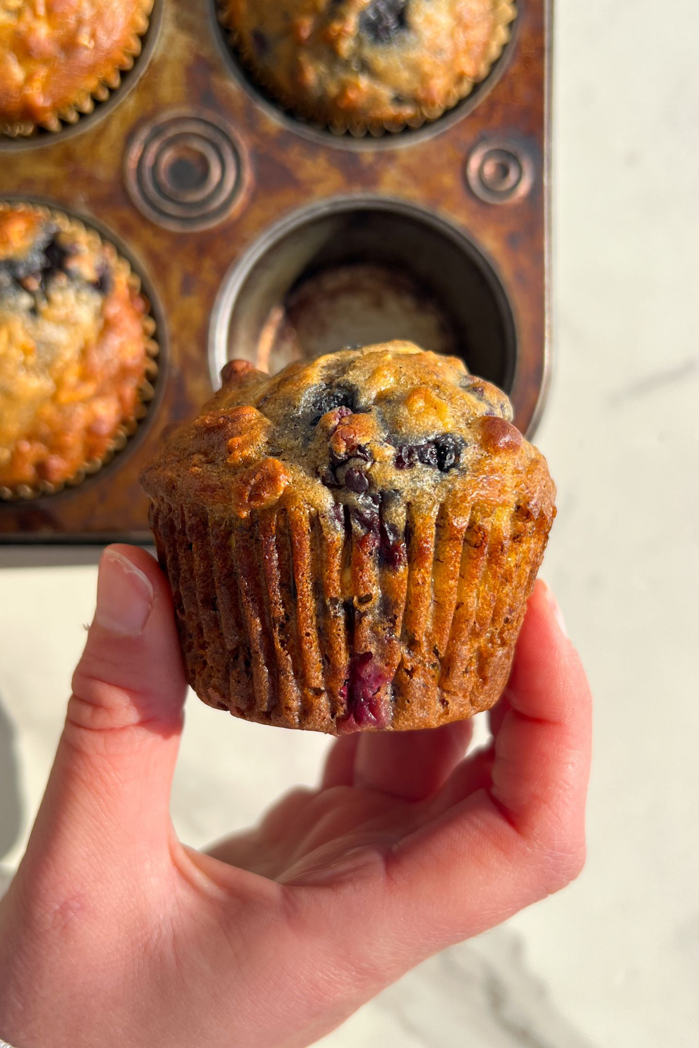 Holding a Blackberry, Banana and Oatmeal Muffin in my hand.