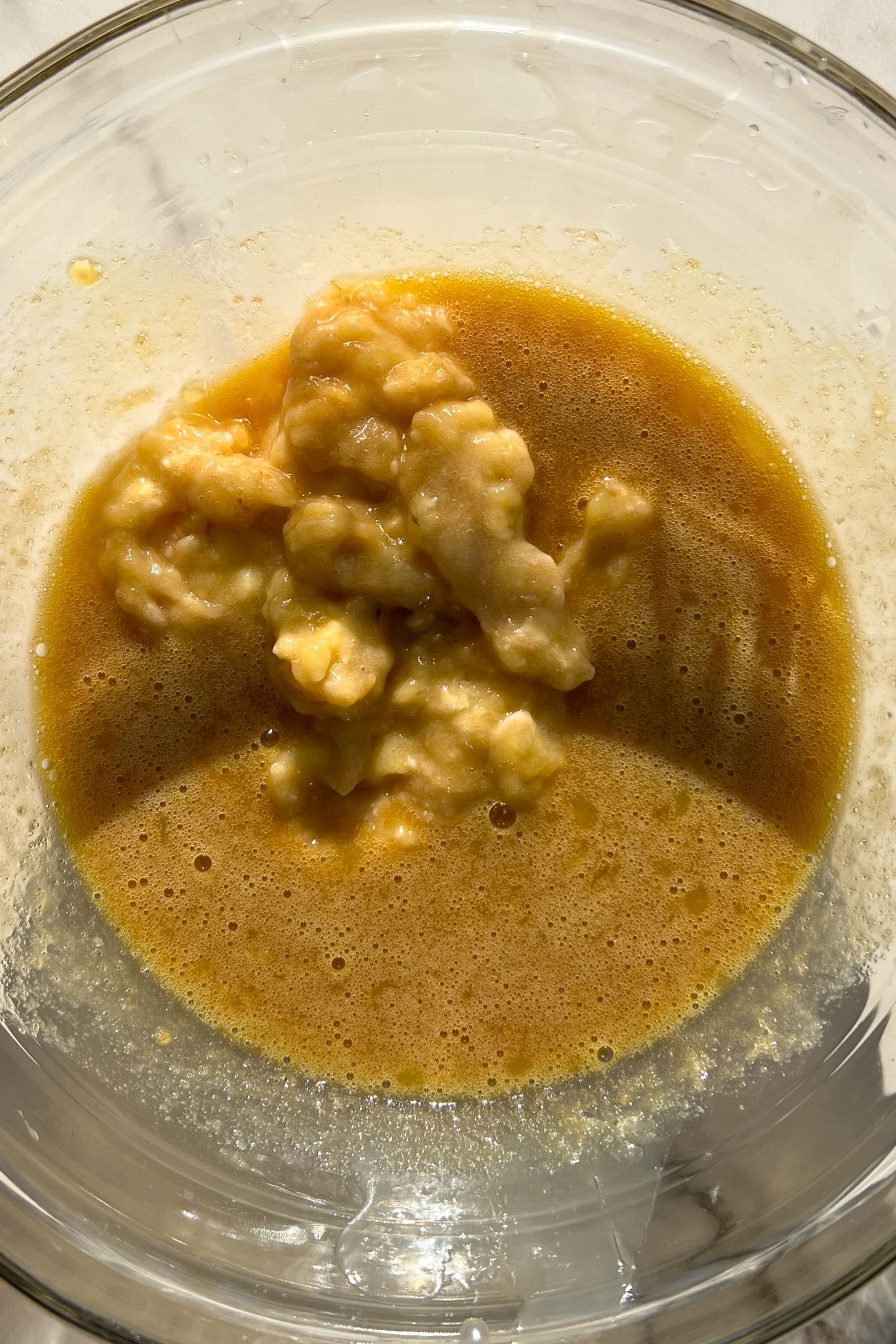 Wet ingredients in a mixing bowl to make the muffin batter.
