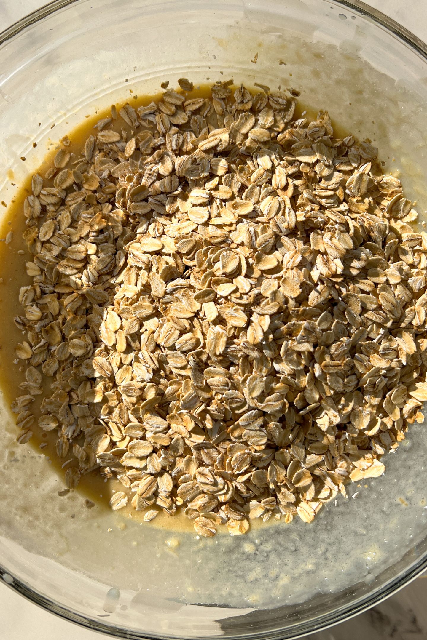 Wet and dry ingredients in a mixing bowl to make the muffin batter.