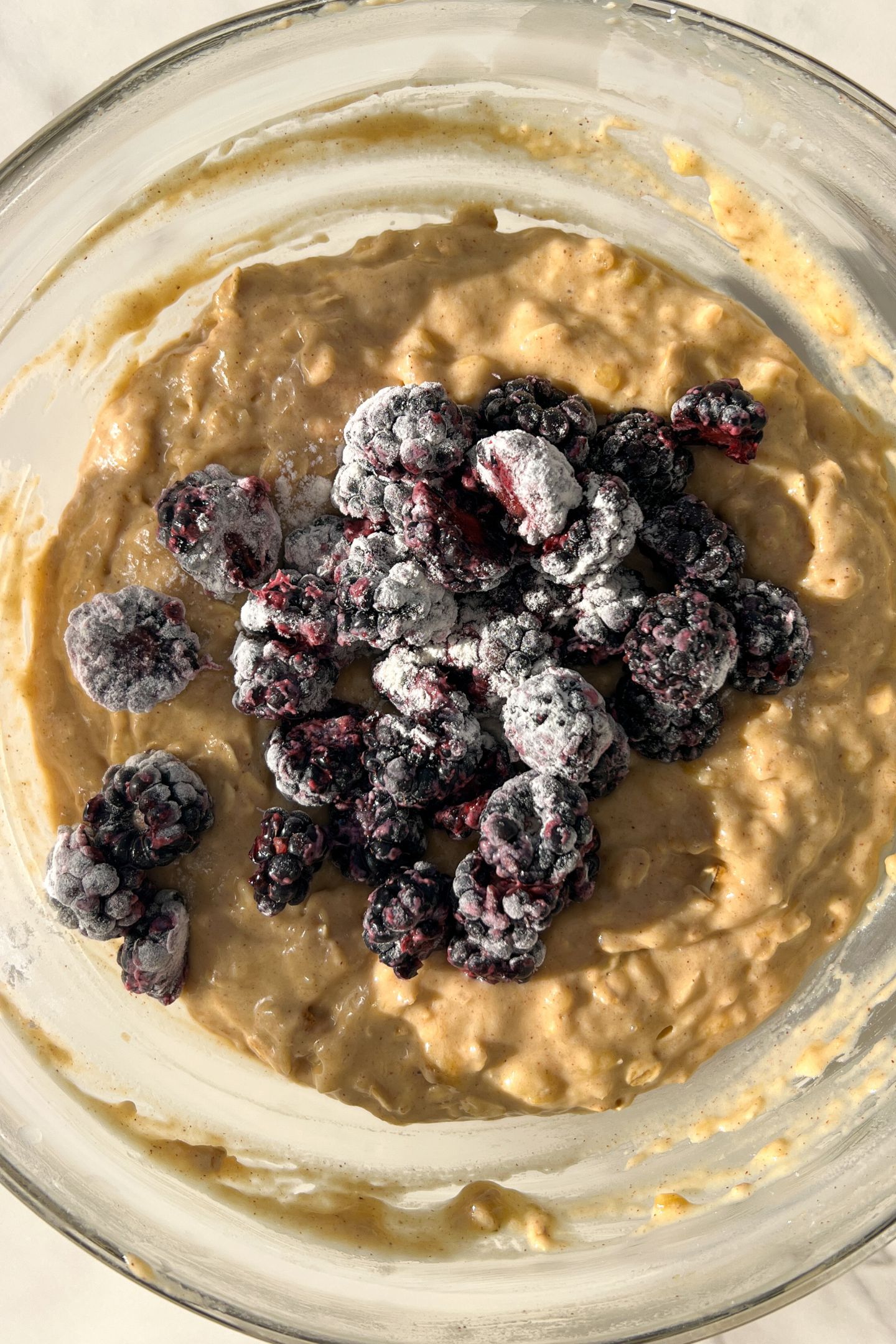 Blackberries tossed in flour and added to the muffin batter.
