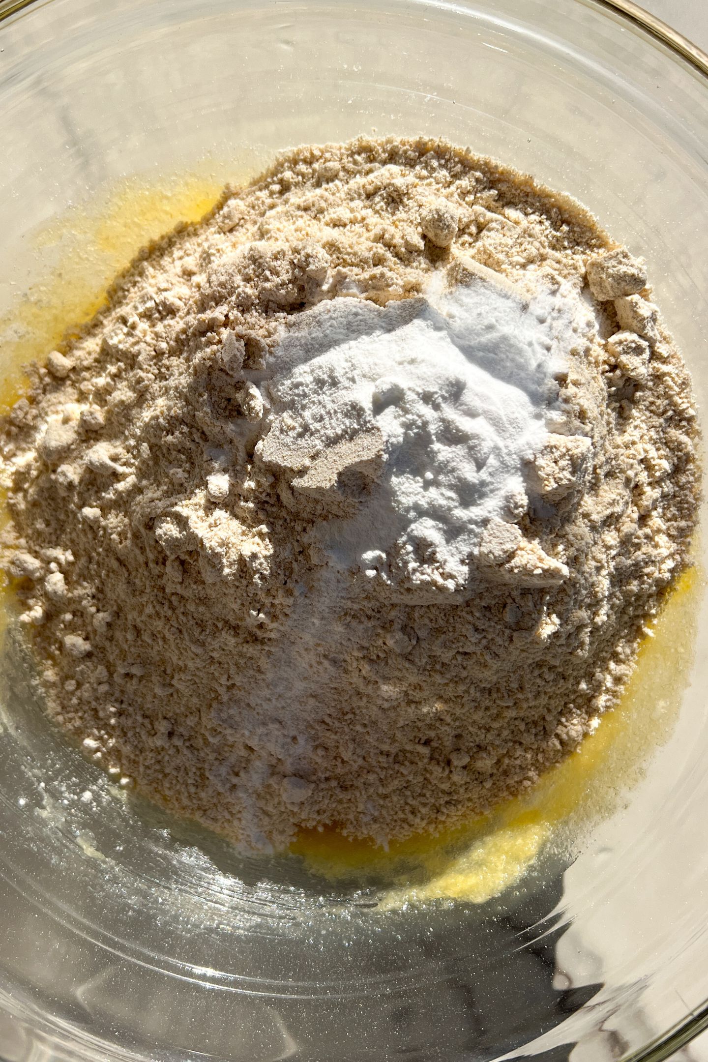 Wet and dry ingredients in a large mixing bowl.